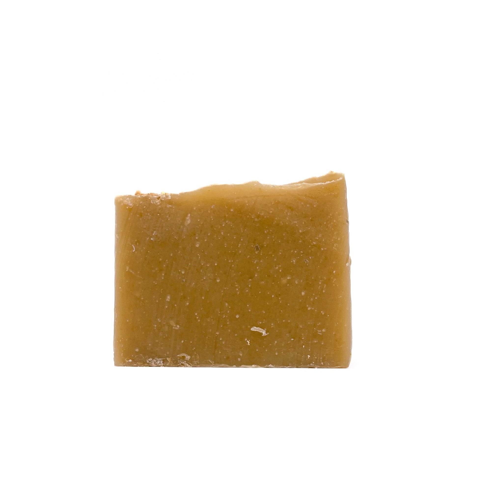 A bar of bamboo colored handmade soap from Rusted Acre Soap Co.