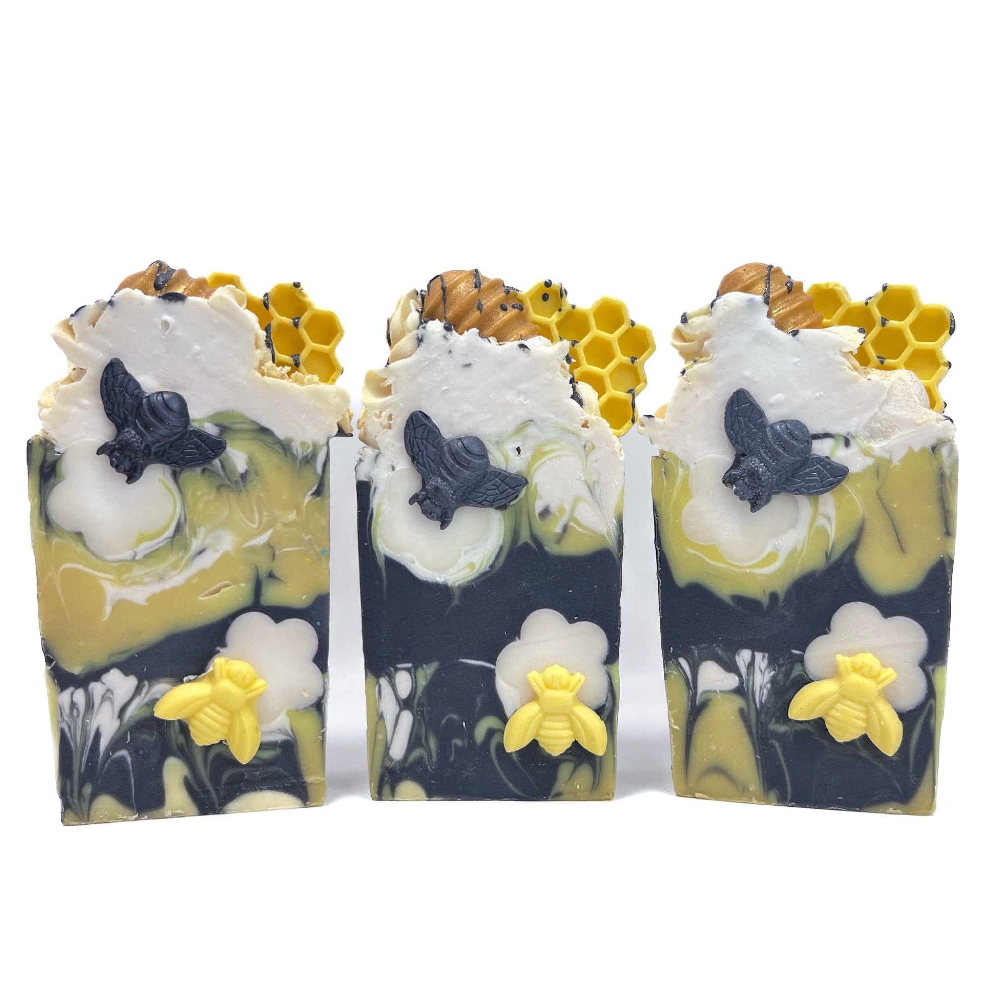Three bars of Rusted Acres Soap Company's Bee Happy handmade soap.