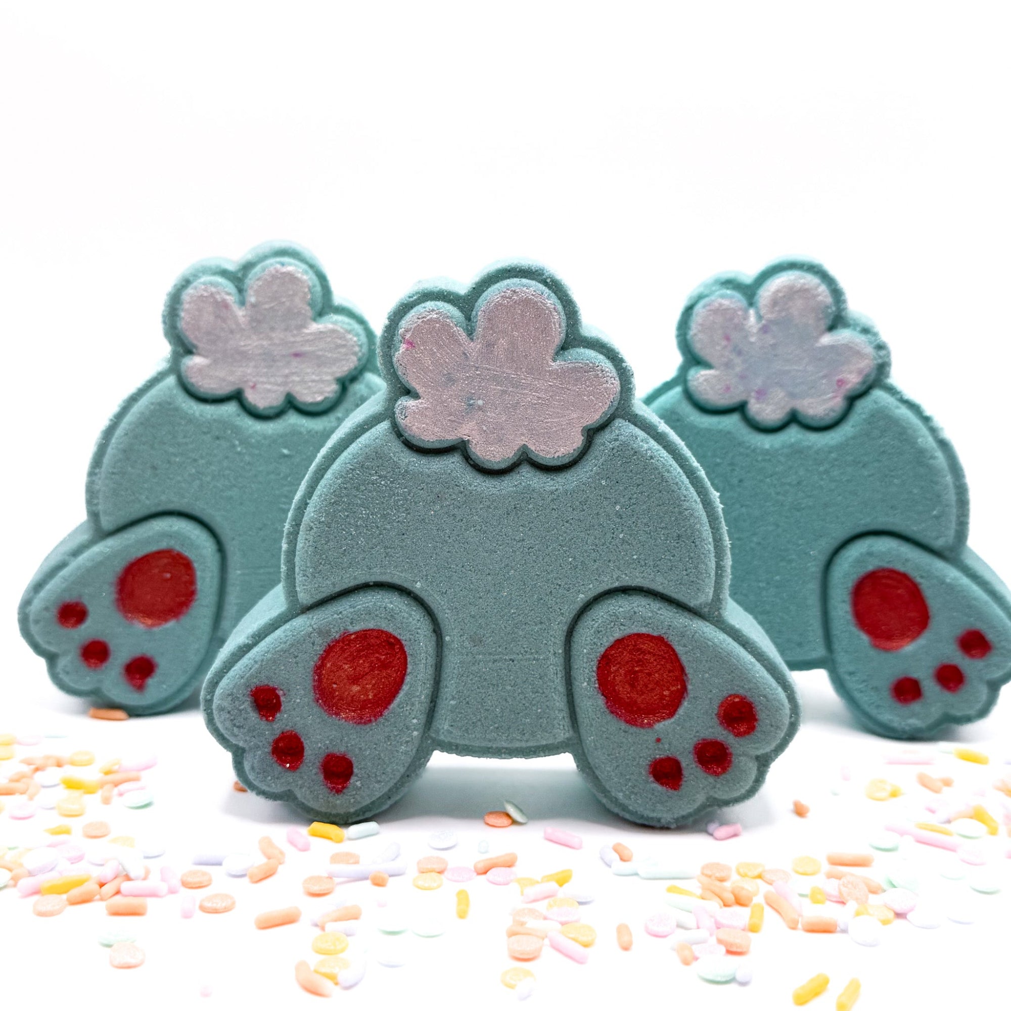 One Teal bunny but bath bomb made by rusted acre soap company.