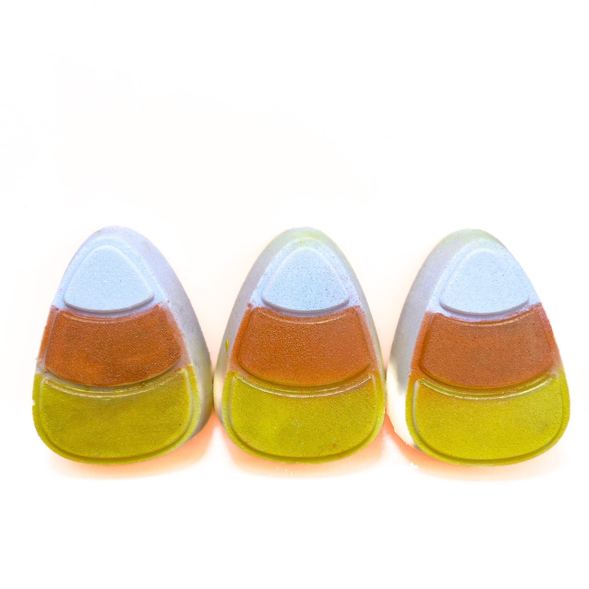 Three candy corn shaped bath bombs. Hand-painted from the bottom up, yellow, orange, white.