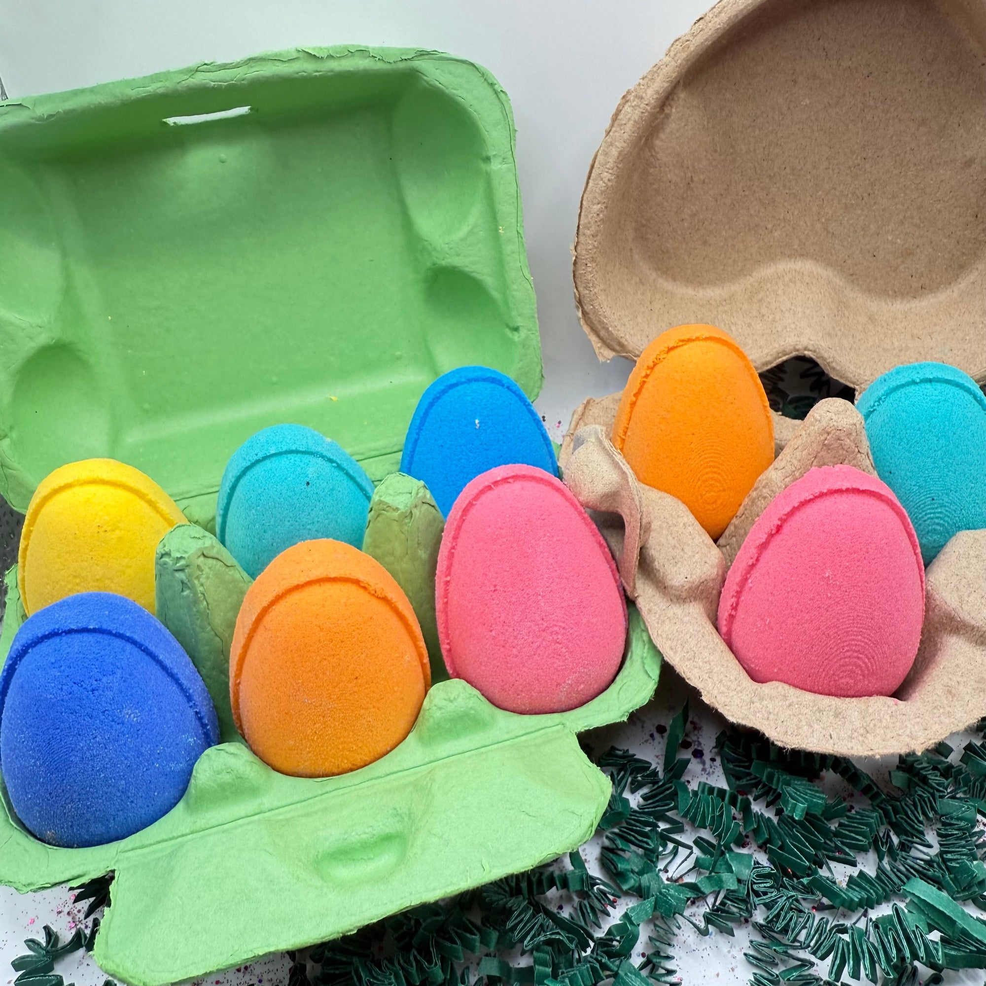 Colorful egg shaped bath bombs for easter made by Rusted Acre Soap Company. Six pack and three pack shown in picture.