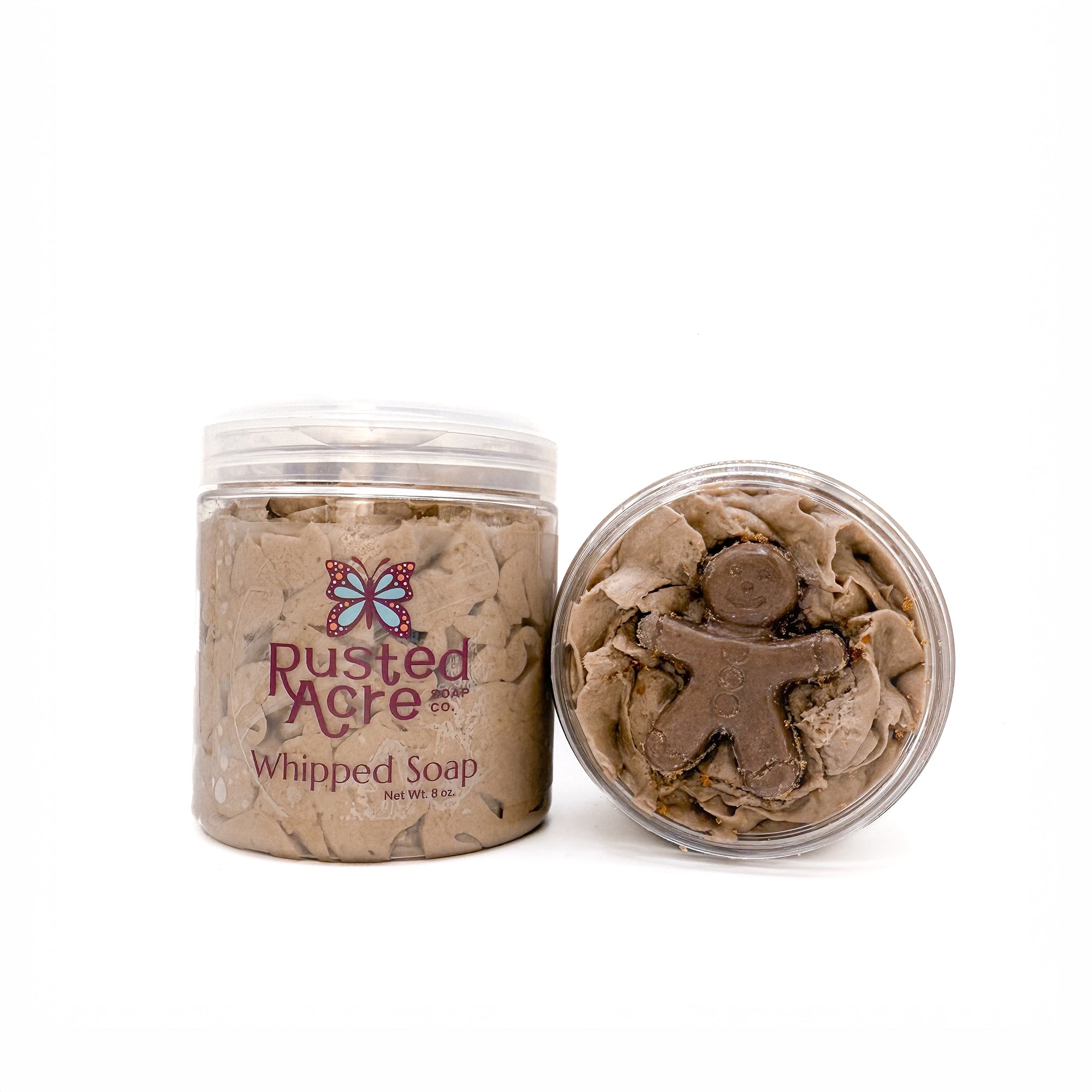 Two jars of Rusted Acre Soap Company’s gingerbread whipped soap front and top view.