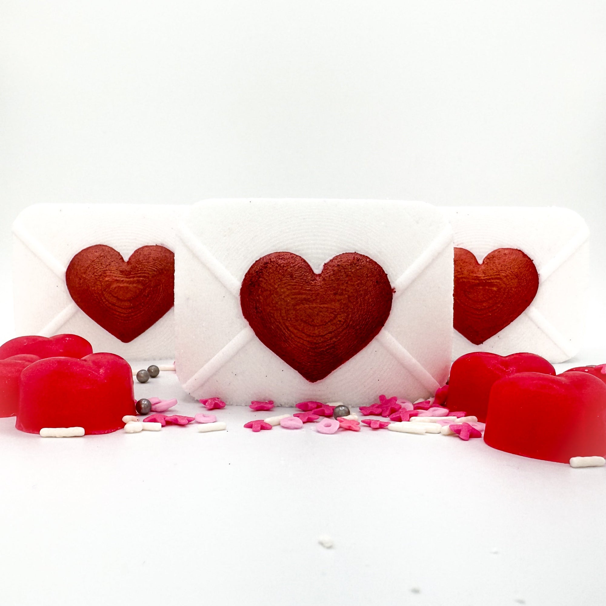 Two Rusted Acre Soap Co white and red heart Love letter bath bombs.
