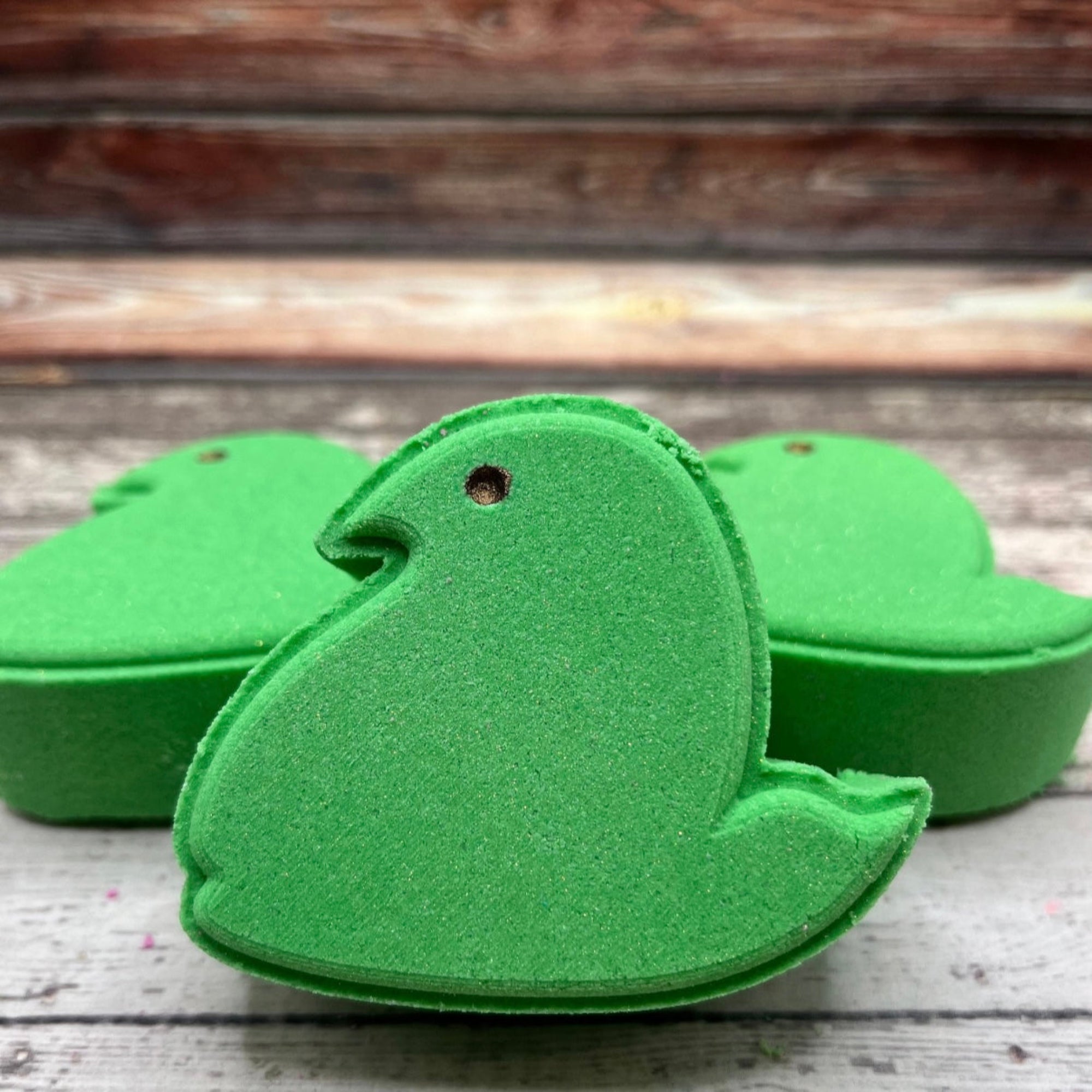 Green marshmallow chick bath bomb made by rusted acre soap company.