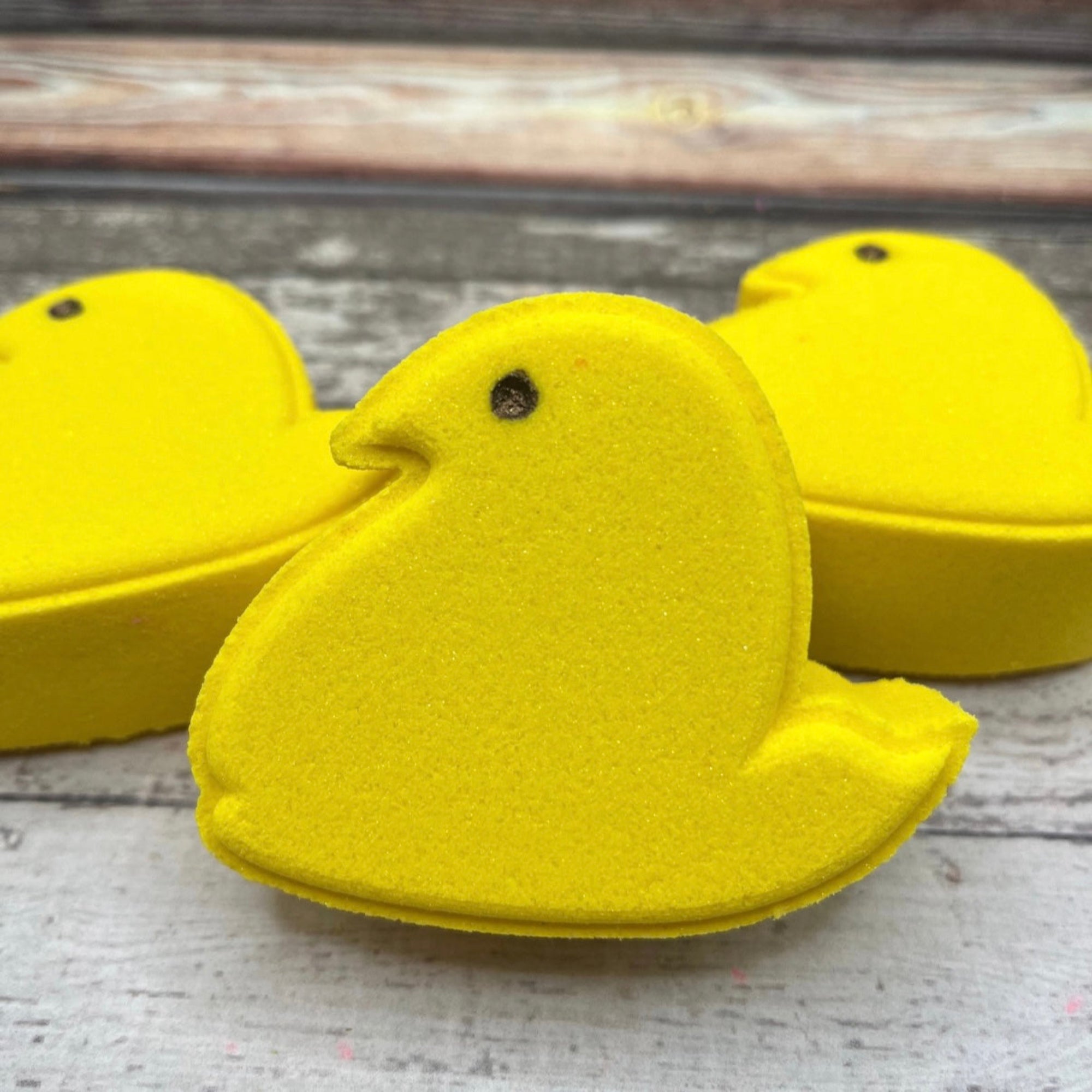 Yellow marshmallow chick bath bomb made by rusted acre soap company.