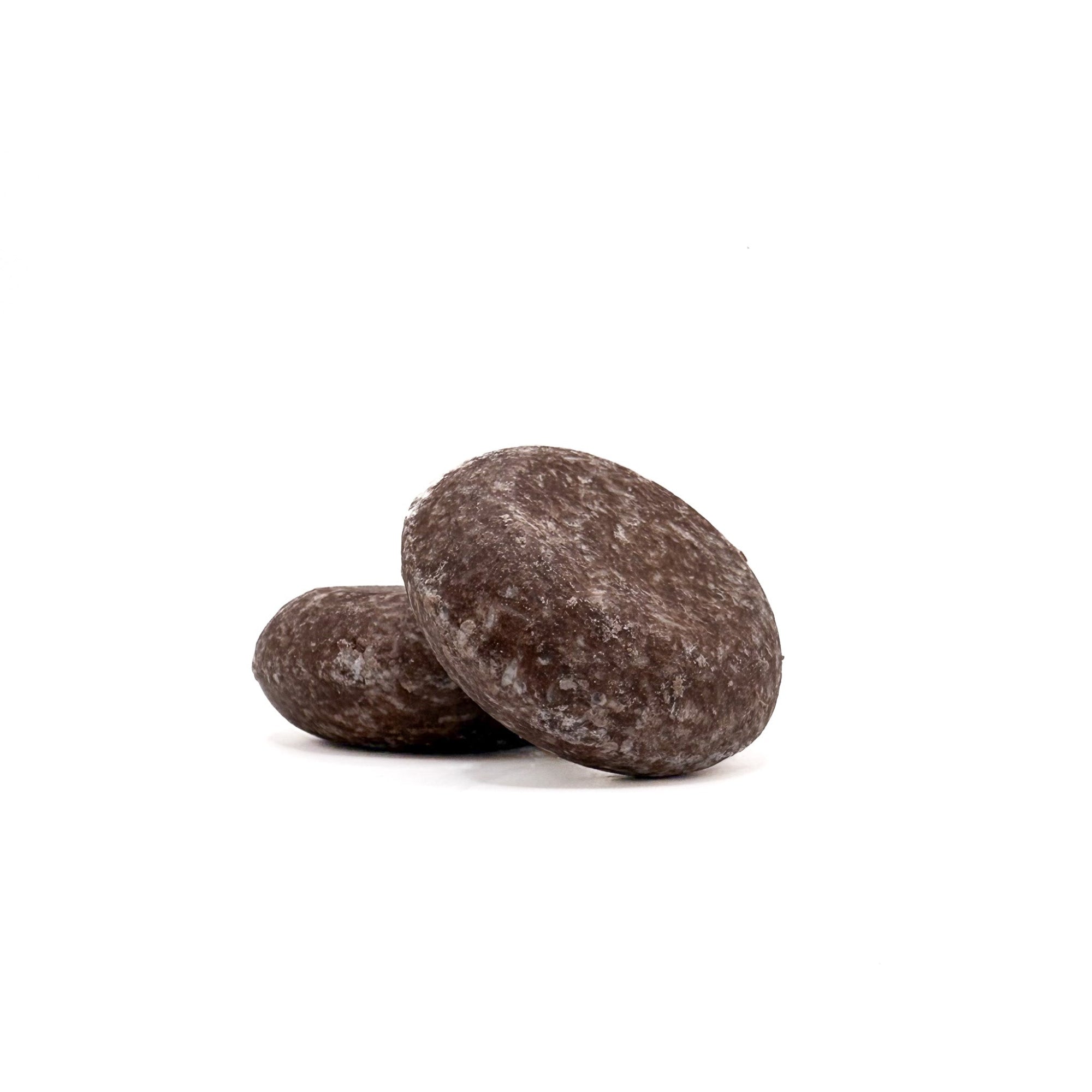 Two brown zero waste shampoo bars in moroccan spice scent from Rusted Acre Soap Company.