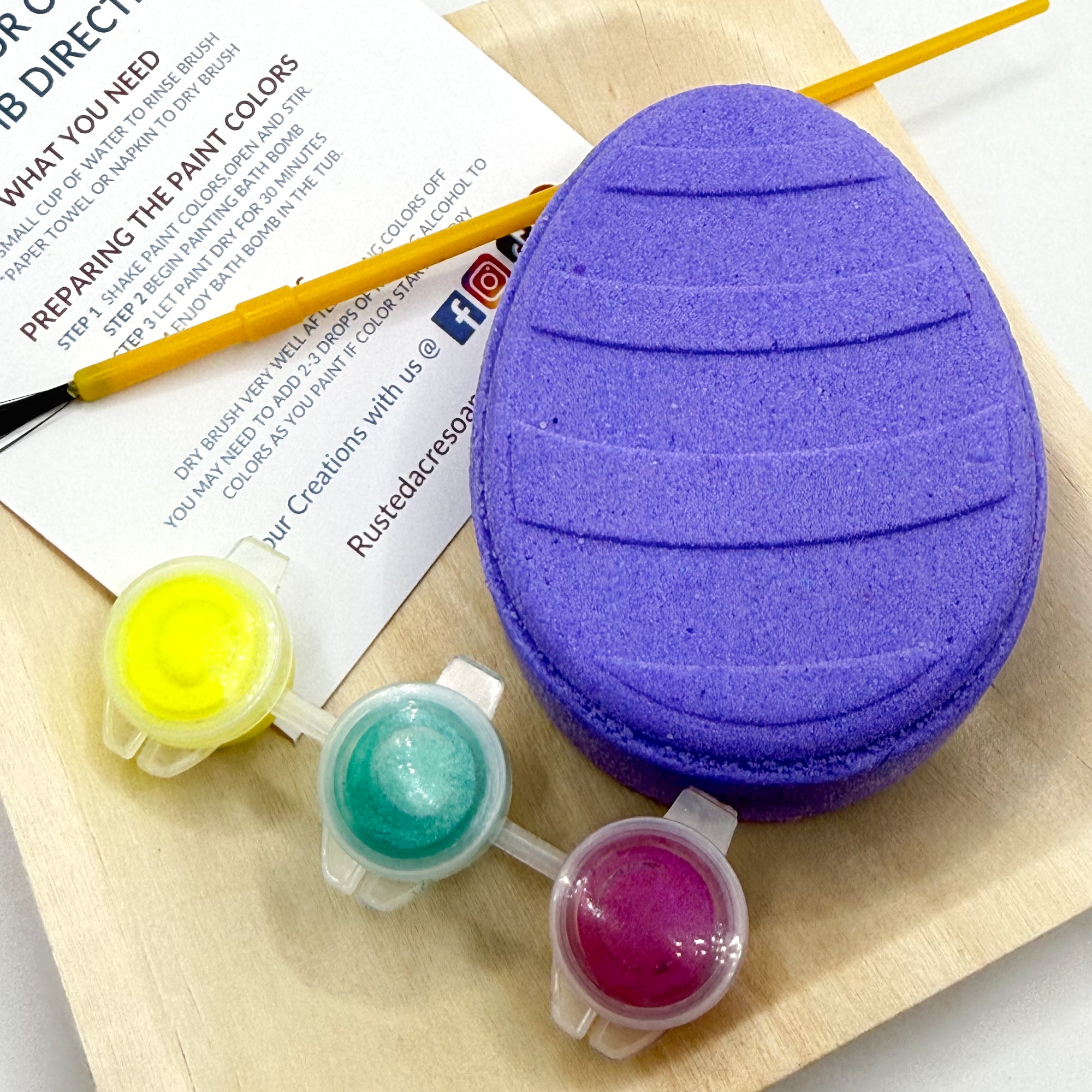 One purple Easter Egg bath bomb kit with paint containers and a brush on a white background hand made by Rusted Acre Soap Co.