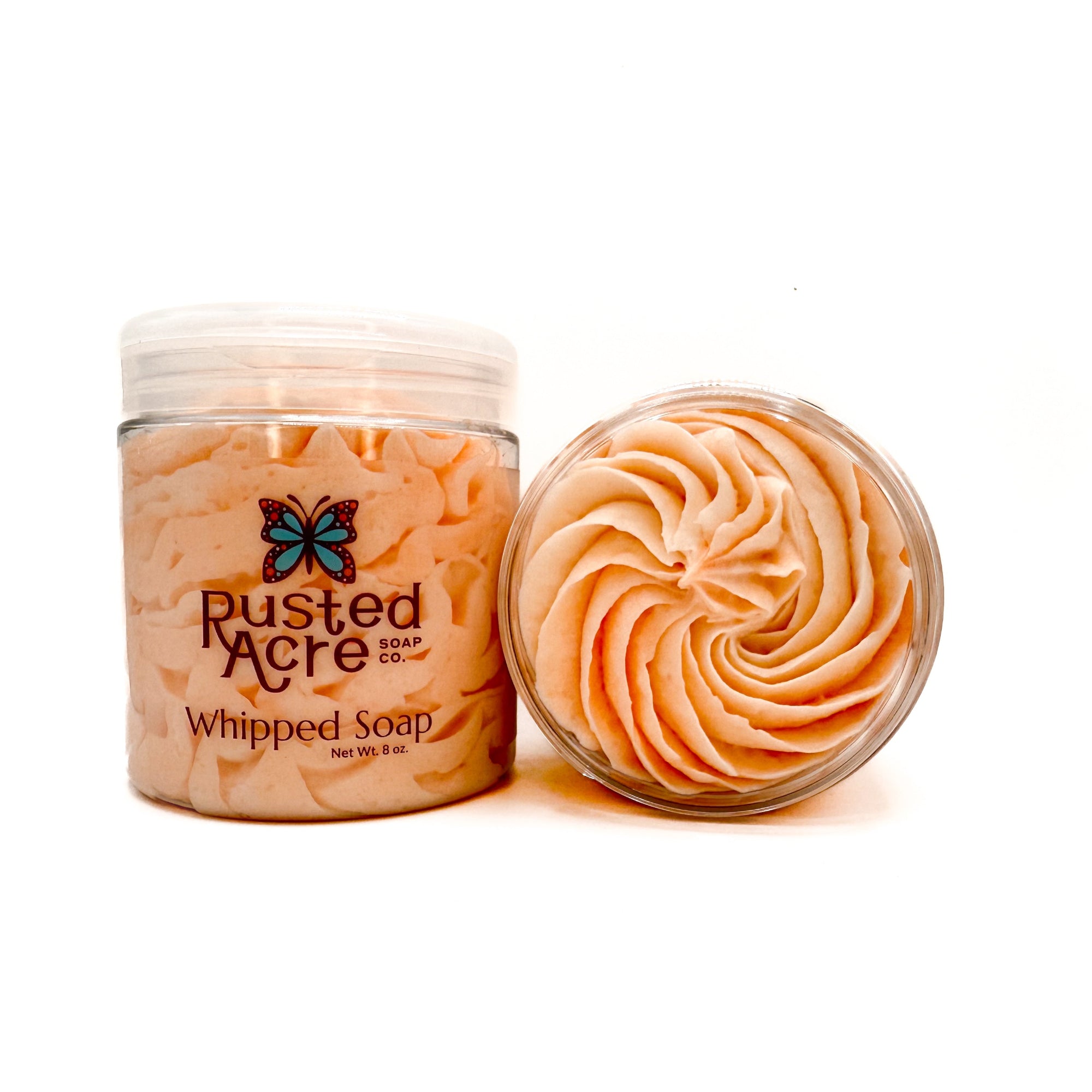 Two jars of Rusted Acre Soap Company’s peach whipped soap front and top view.