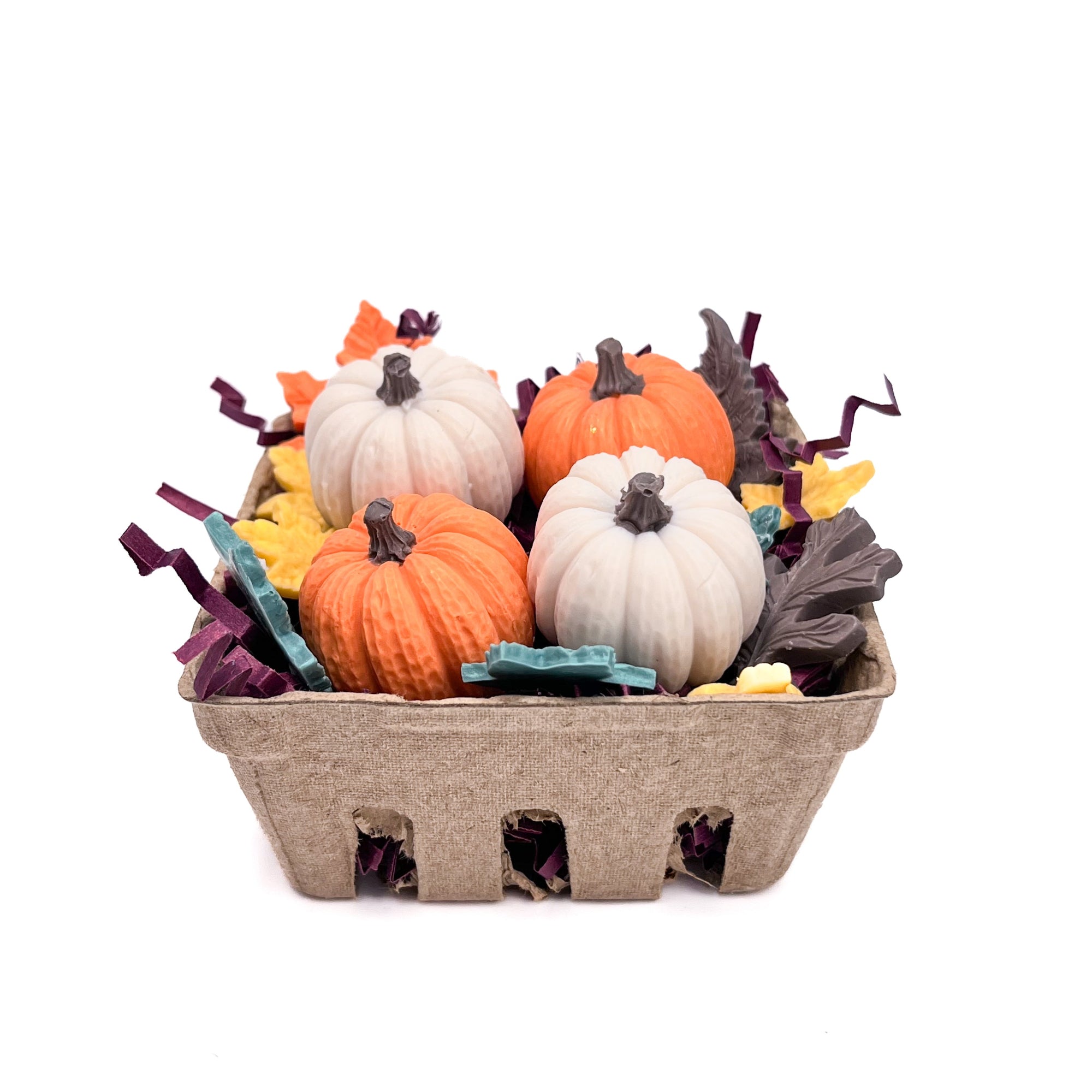 Decorative basket with small soap pumpkins and fall leaves on a white background hand made by Rusted Acre Soap Co.