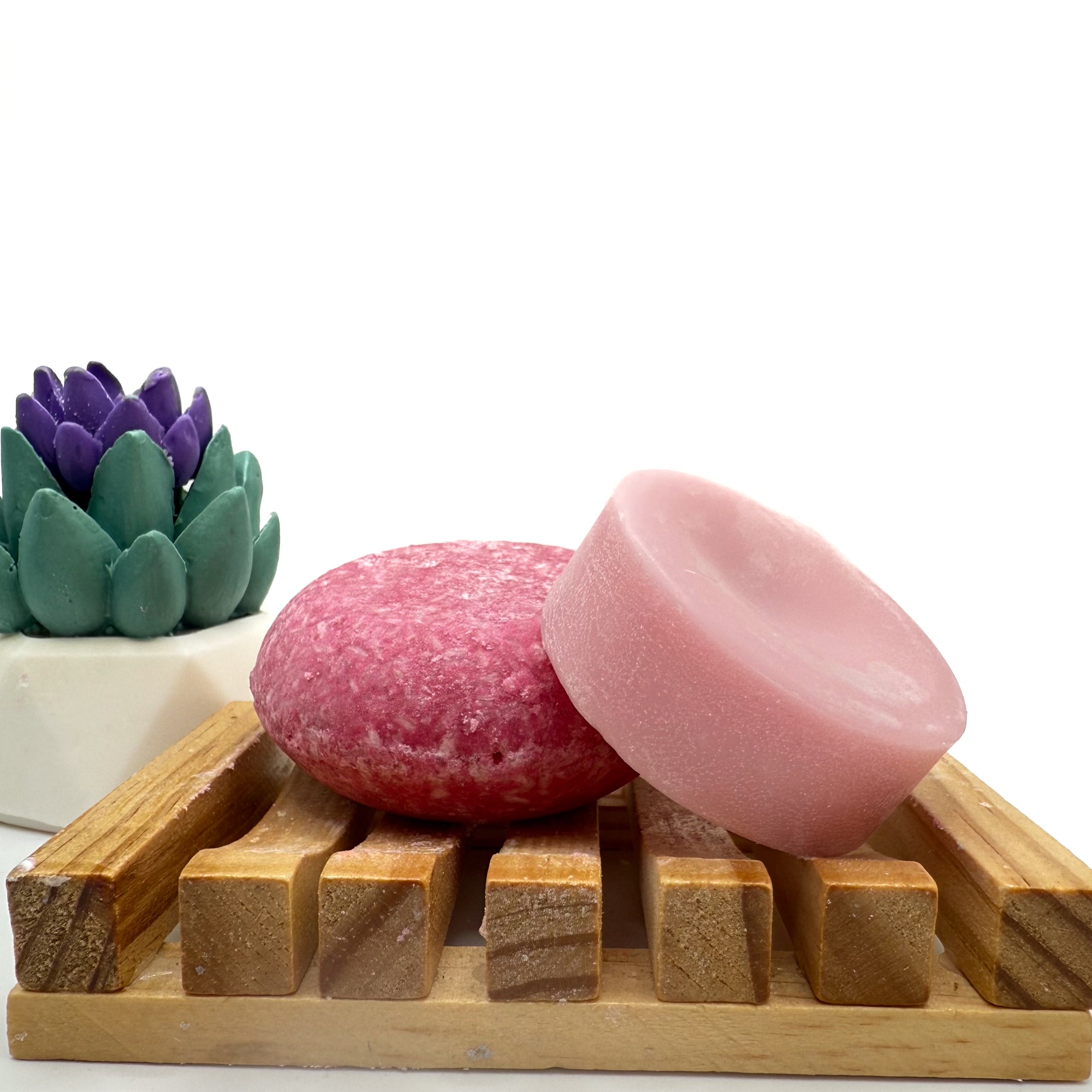 Pink Beach vibes zero waste Shampoo and Conditioner bar on a wood soap dish with a white background.