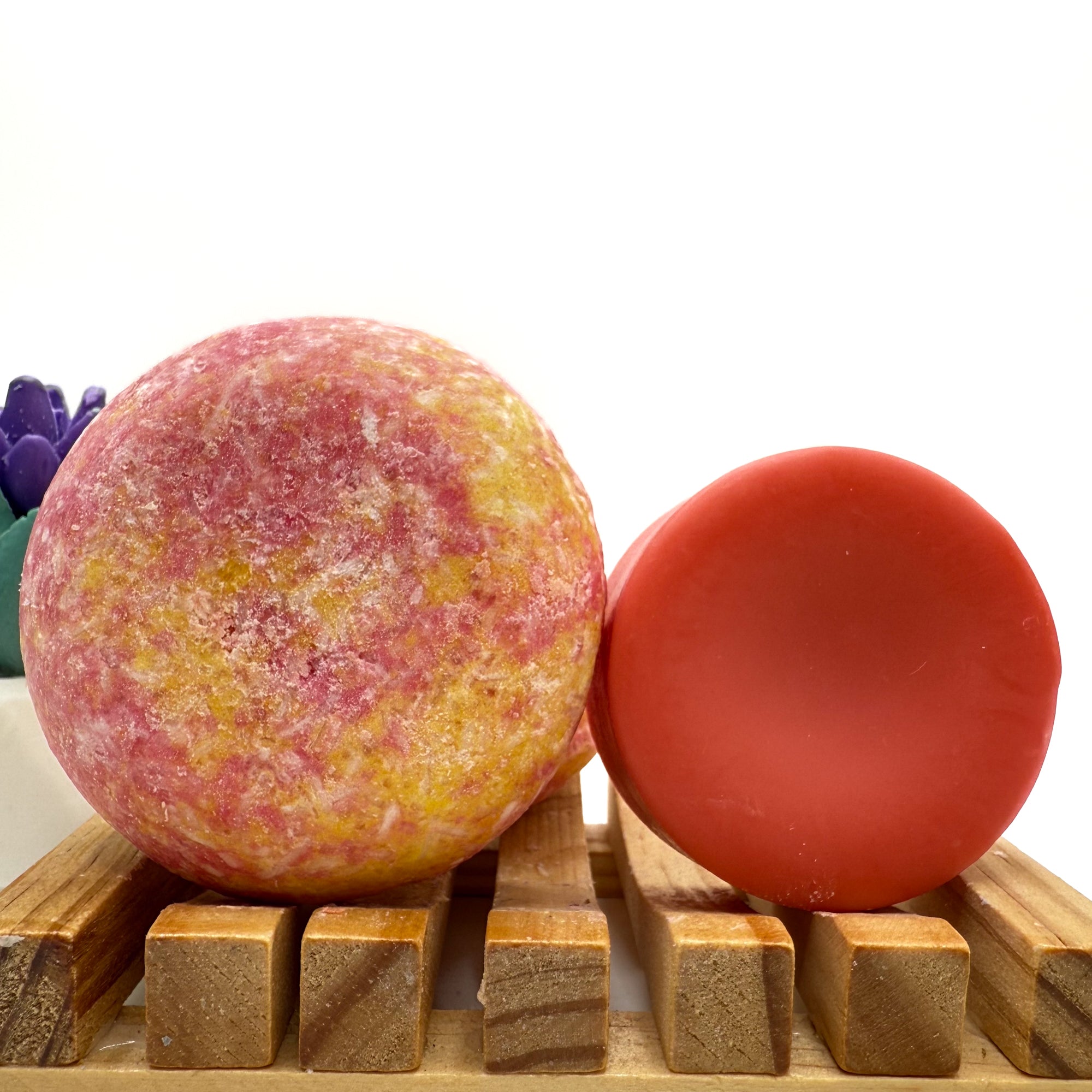 Island Hibiscus zero waste Shampoo and Conditioner bar on a wood soap dish with a white background standing on side.