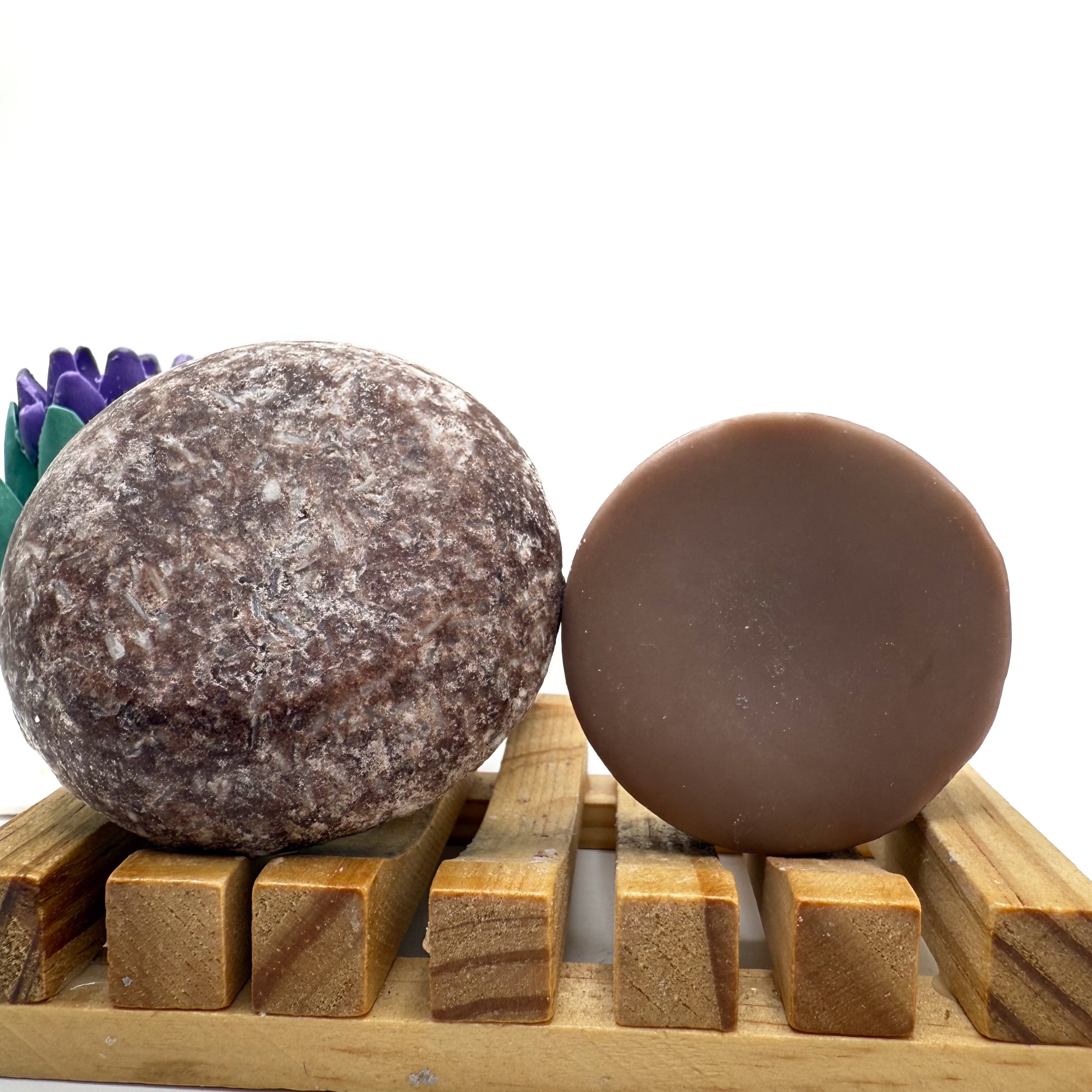 Moroccan Spice zero waste Shampoo and Conditioner bar on a wood soap dish with a white background standing on side.