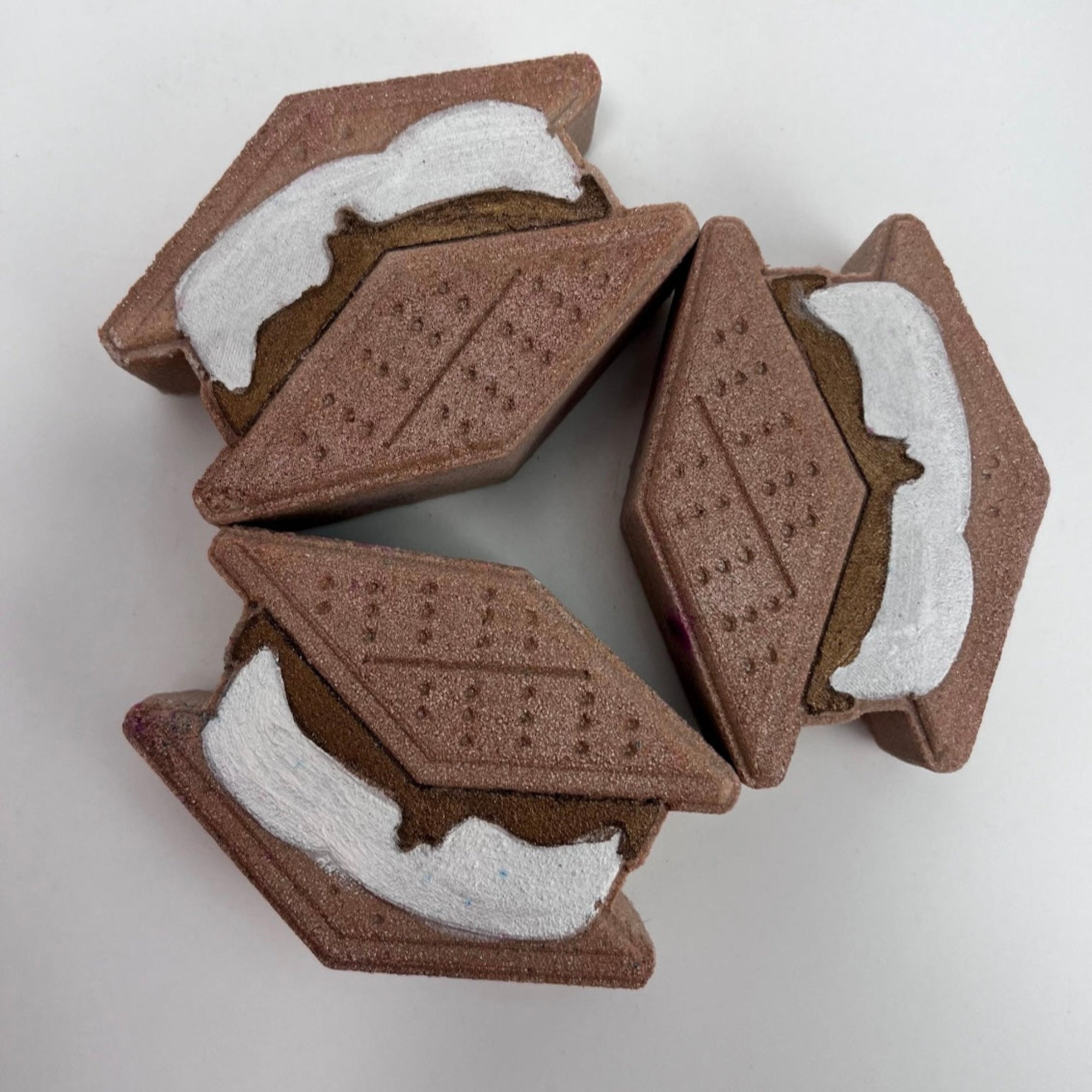 Three hand painted smores bath bombs.