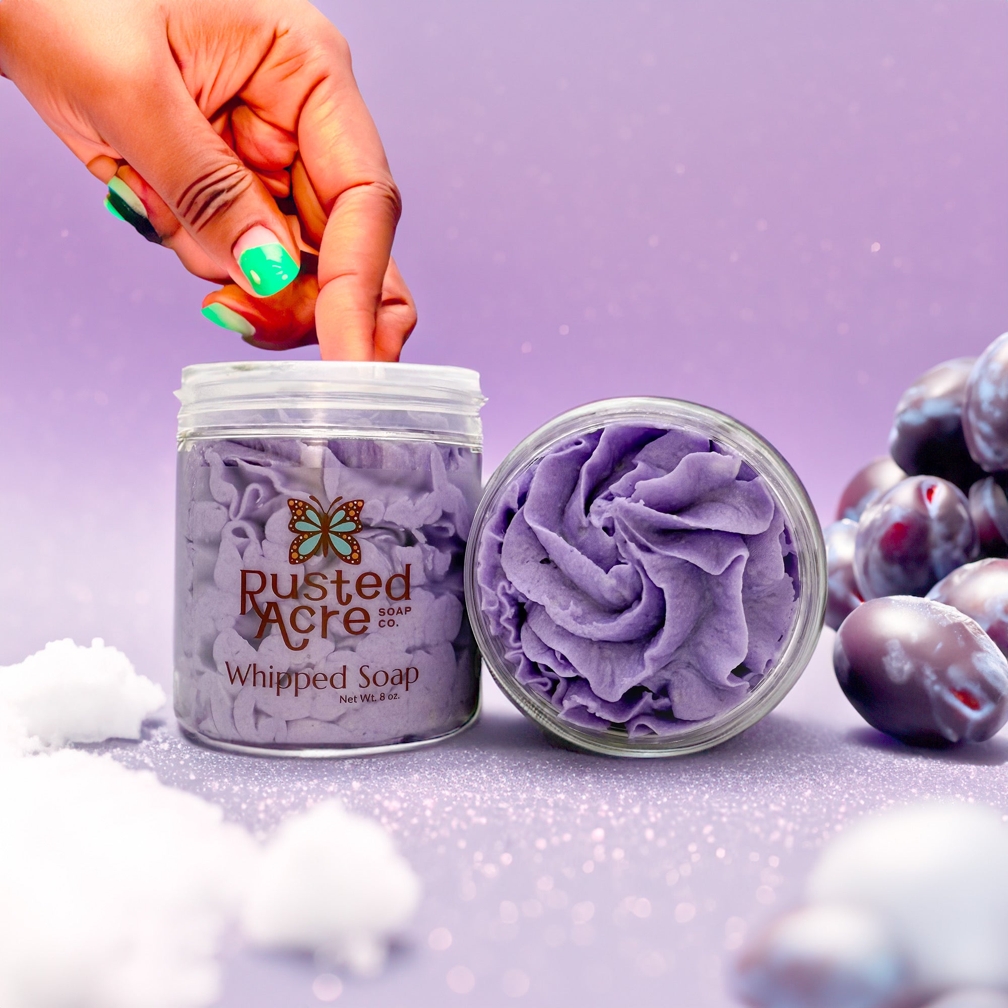 Rusted Acre Soap Company's sugar plum fairy whipped soap. Two jars in a lifestyle setting front and to view.