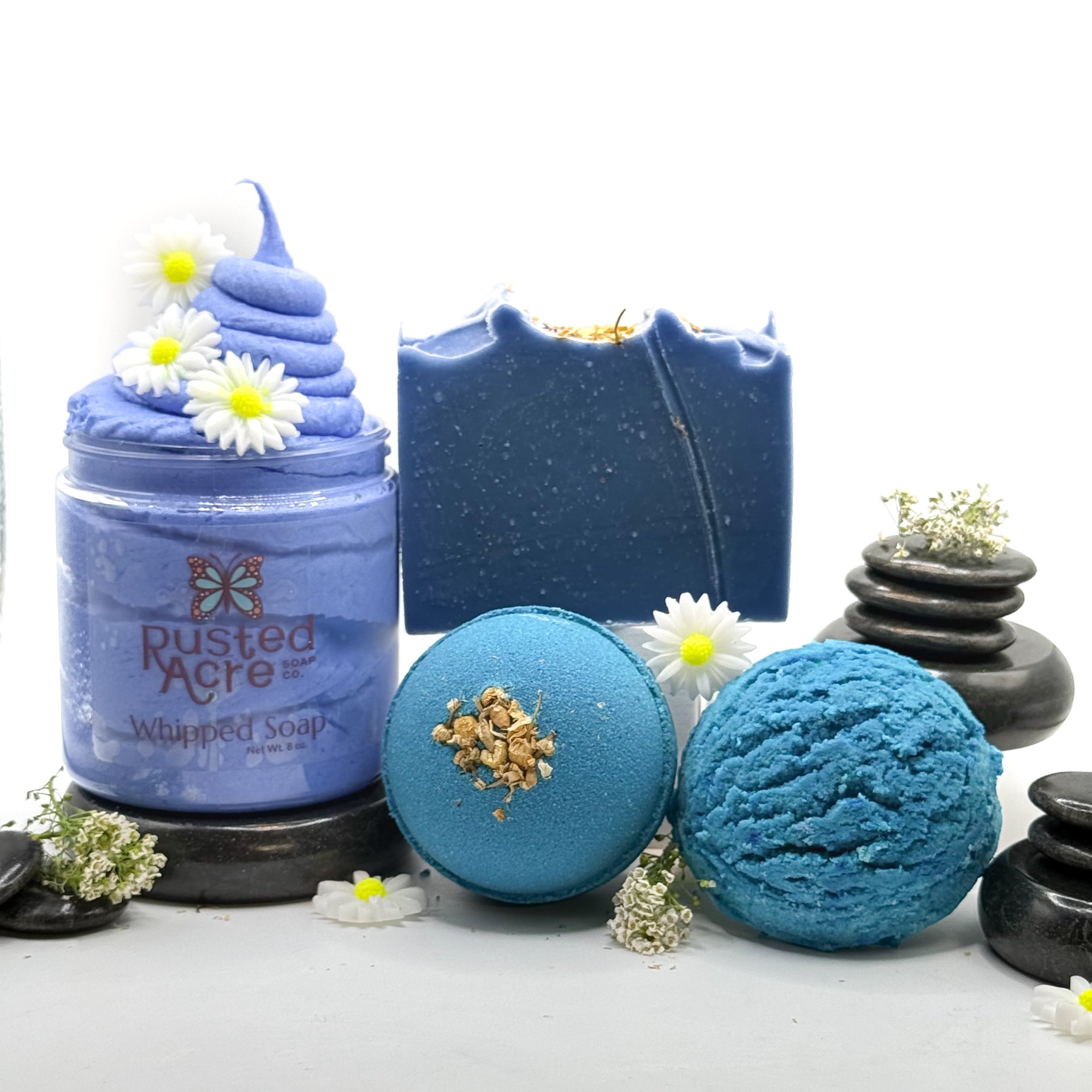 Full set of tranquility bath products made by Rusted Acre Soap Company. Pictured is Blue whipped soap, blue bath bomb, blue bar soap, blue bubble scoop.