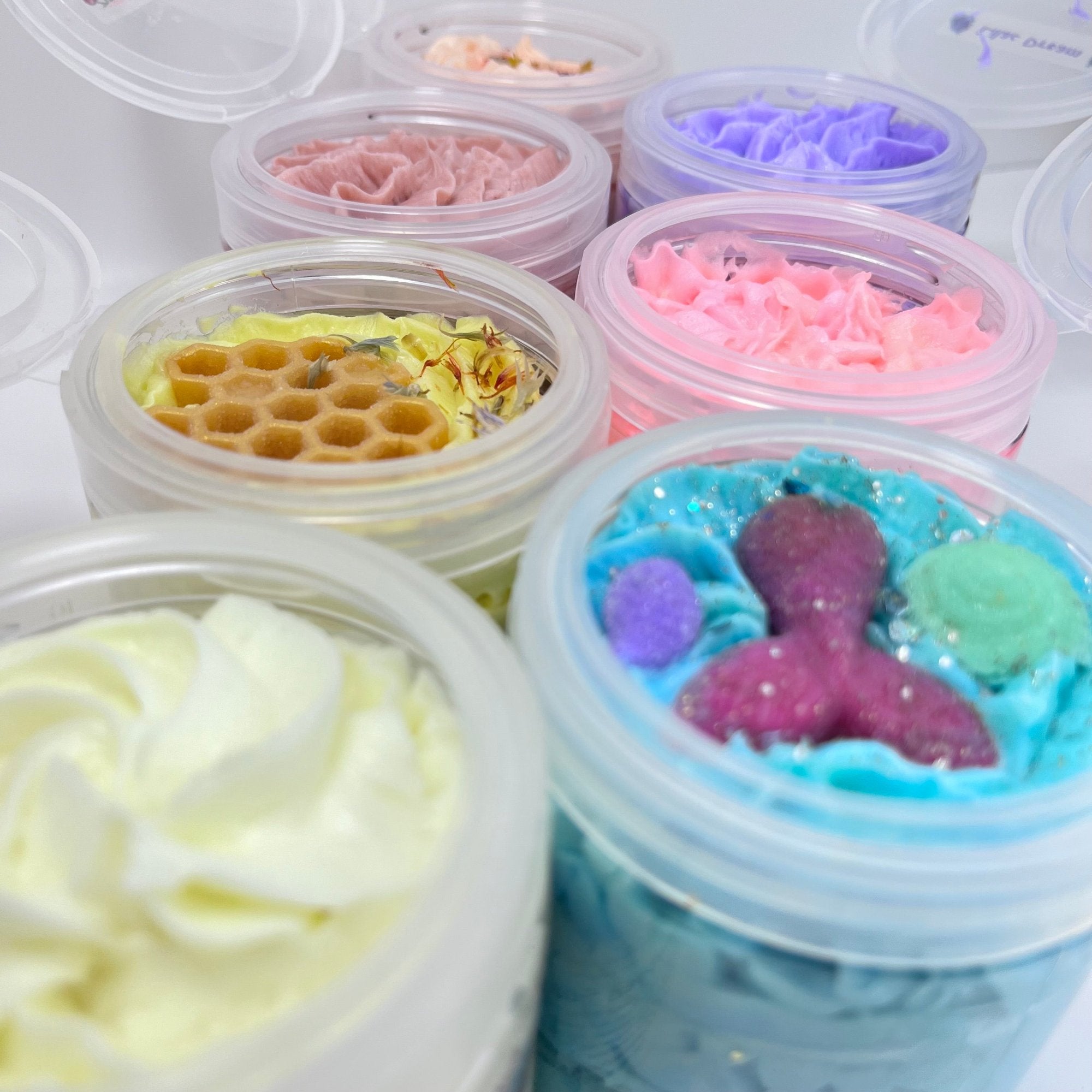 Multiple tops of Rusted Acre Soap Co's hand pipped whipped soap