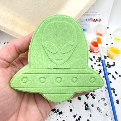Handmade green alien ufo bath bomb with paint your own supplies from rusted acre soap co. 