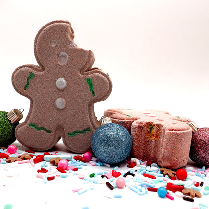 Brown gingerbread man bath bomb with Christmas decorations on a white background. Made with premium ingredients and hand crafted in small batches.