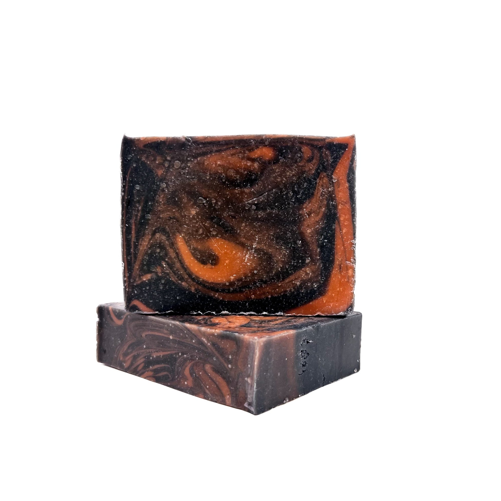 Two bars of black cherry handmade soap swirled red and black.