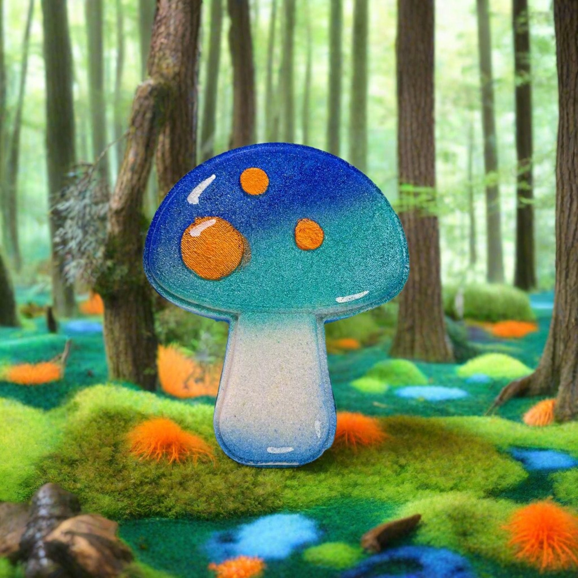 A teal-blue mushroom shaped bath bomb on a whimsical woods background.