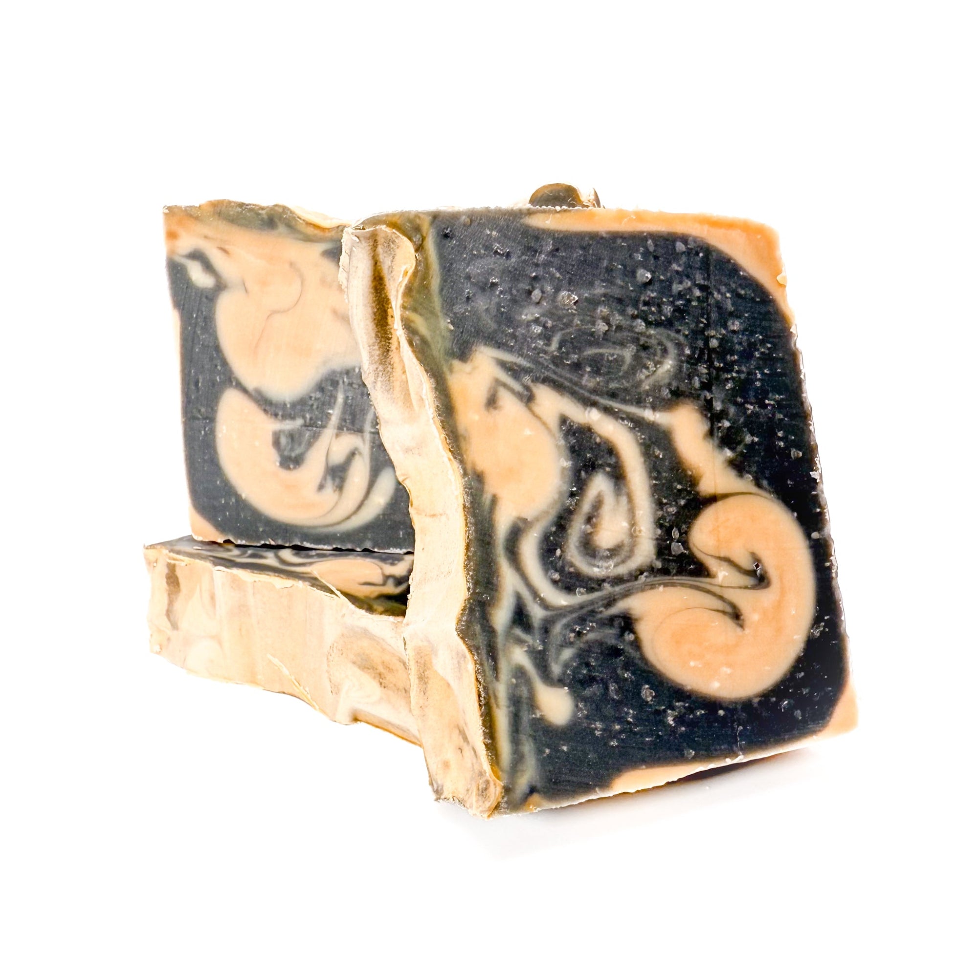Three bars of handmade, natural Cashmere bar soap from Rusted Acre Soap Co. Tan and black swirled colors.