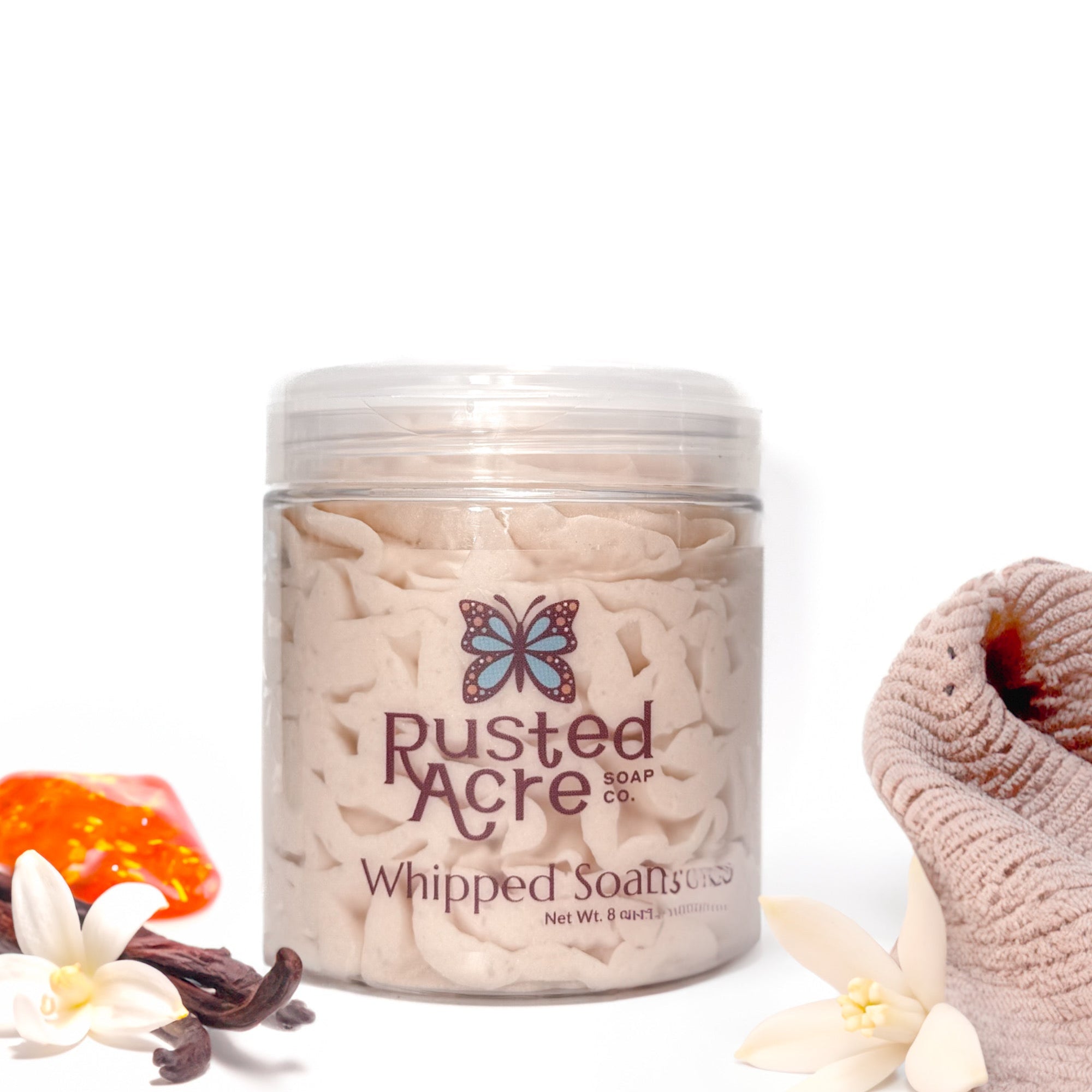 Jar of Rusted Acre Soap Company's vegan cashmere whipped soap. Light tan soap in a reusable plastic jar in a lifestyle setting. 
