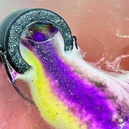Witches cauldron in the water displaying vibrant colors, hand made by Rusted Acre Soap Co. 