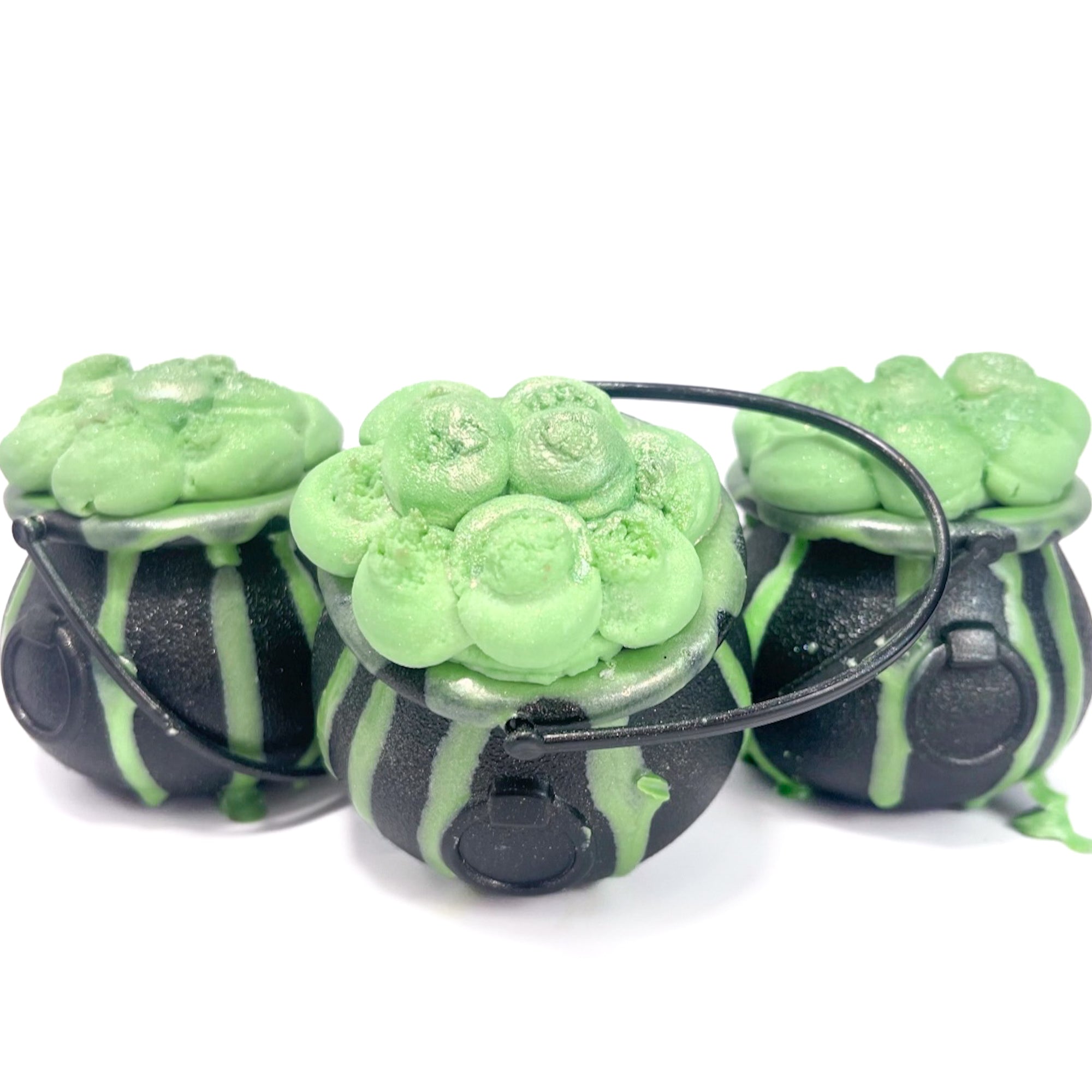Three witches Cauldron bath bombs with green bubble frosting.  