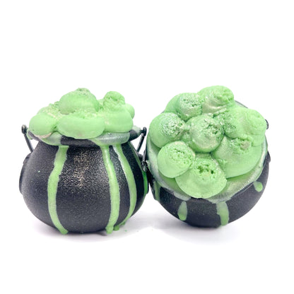 Two witches Cauldron bath bombs with green bubble frosting.  