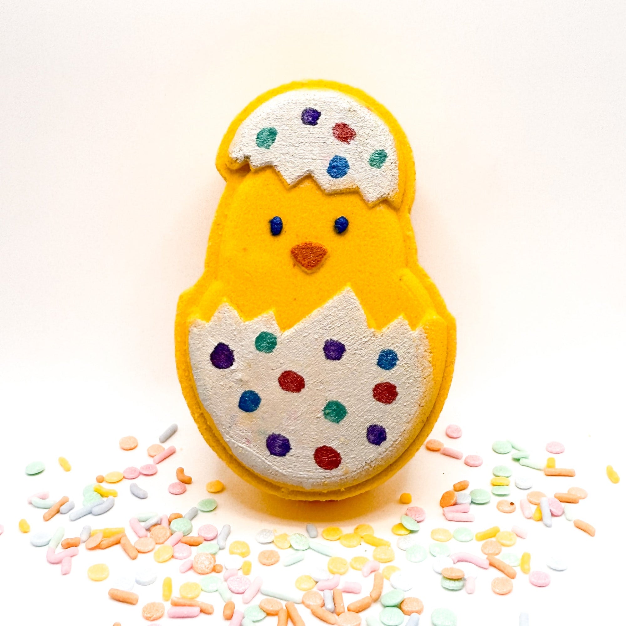 One Easter Chick in a decorated easter egg bath bomb hand painted by Rusted Acre Soap Company. 