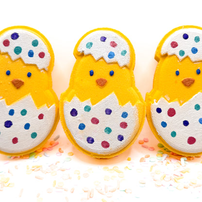 Three chicks in decorated easter egg bath bombs hand painted by Rusted Acre Soap Company. 