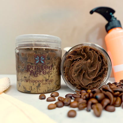 Two jars of Rusted Acre Soap Company’s coffee whipped soap front and top view in a lifestyle setting. 