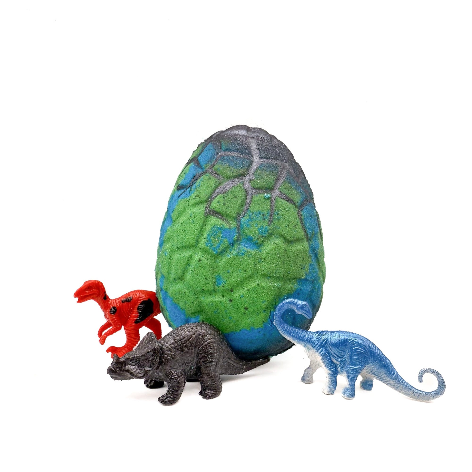 Rusted Acre Soap Co's kids dinosaur egg bath bomb. Green and blue egg with toy dinosaur inside. 