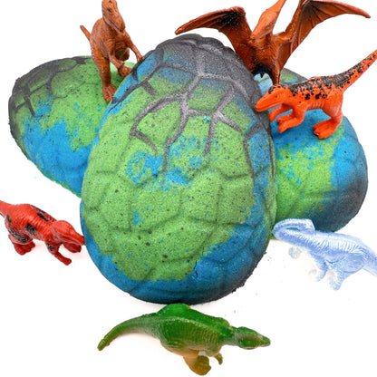 Dino Egg bath bomb for kids made by Rusted Acre Soap Company. Three blue and green eggs in picture with dinosaur toys.