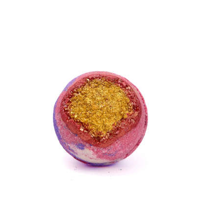 Round bath bomb made of red, white, and blue hand-painted gold and red Epsom salt.