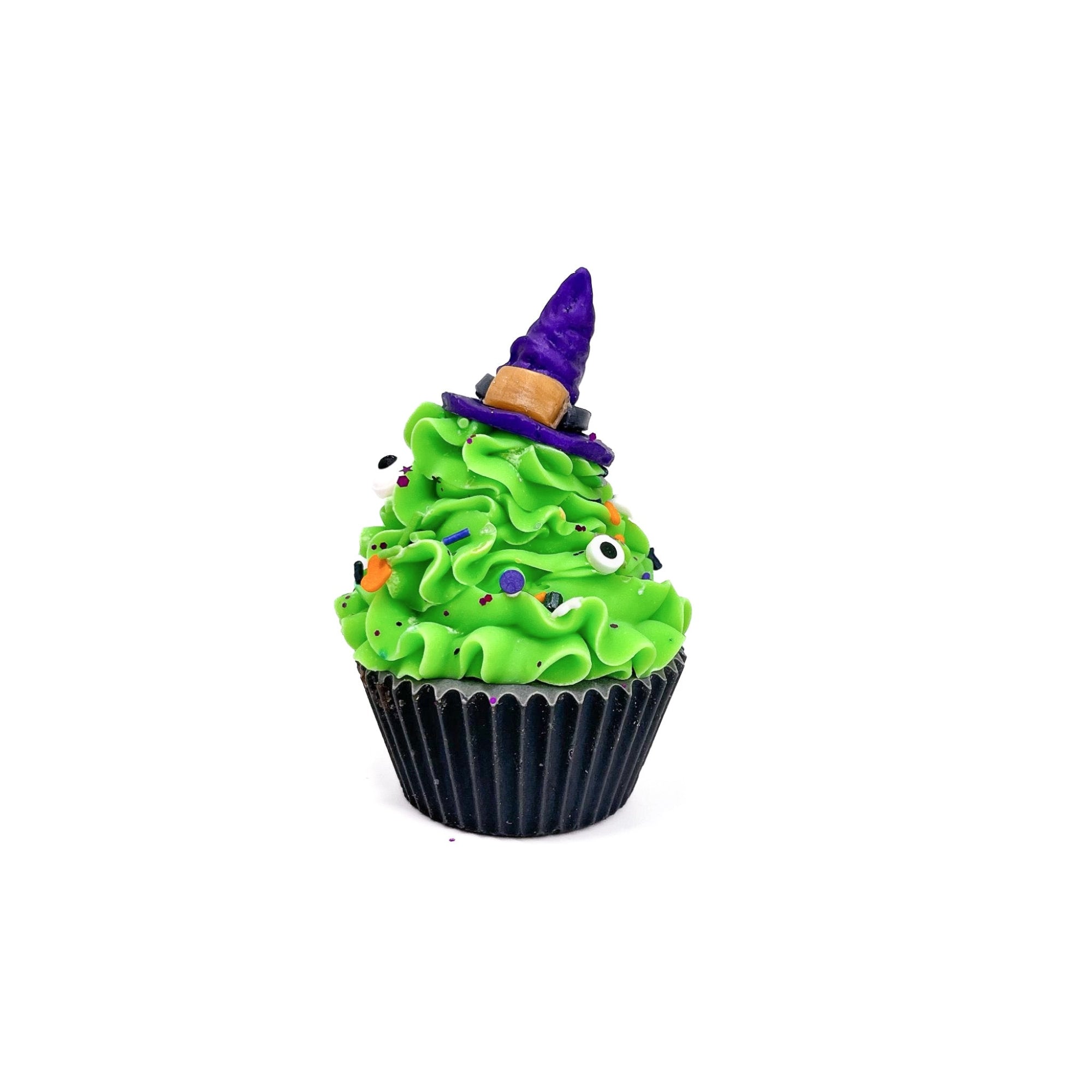 One cupcake shaped cold process soap. Black cake bright green frosting with a shimmery purple witches hat on top. 