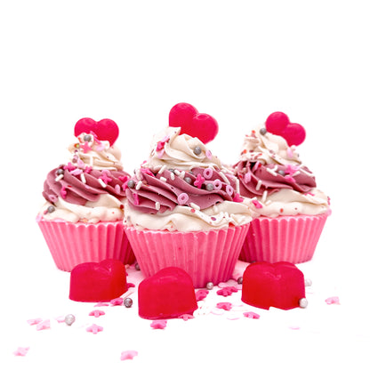Three heart cupcake soaps from Rusted Acre Soap Co. Pink cake topped with pink and white frosting and pink heart soap embeds.