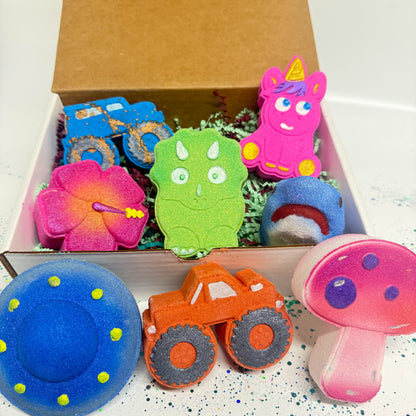 A box full of different kids themed bath bombs in multiple colors for a kids subscription box. 
