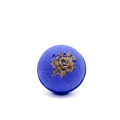 One purple round, lavender scent bath bomb. Displayed with lavender buds. 