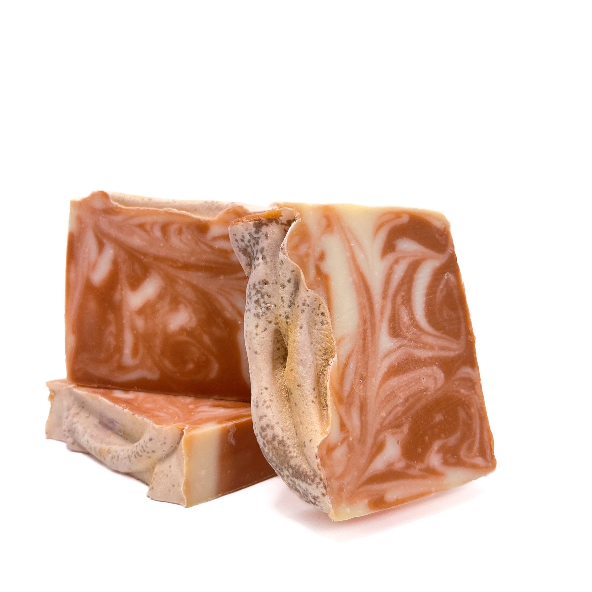 Three bars of lavender scented handmade soap. Colors are purple and natural.