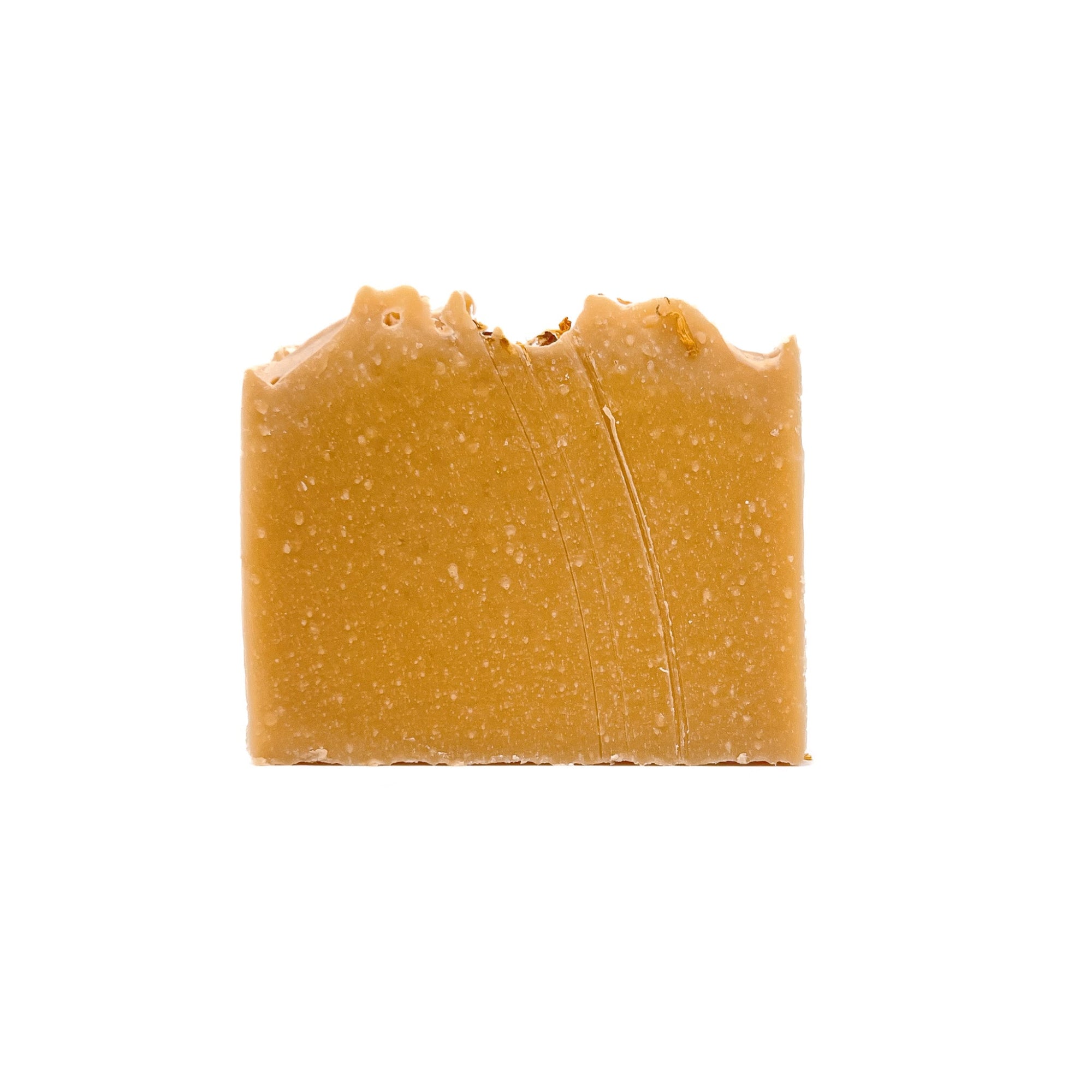 A bar of lemon cupcake scented handmade soap. Colored yellow with Brazilian yellow clay.