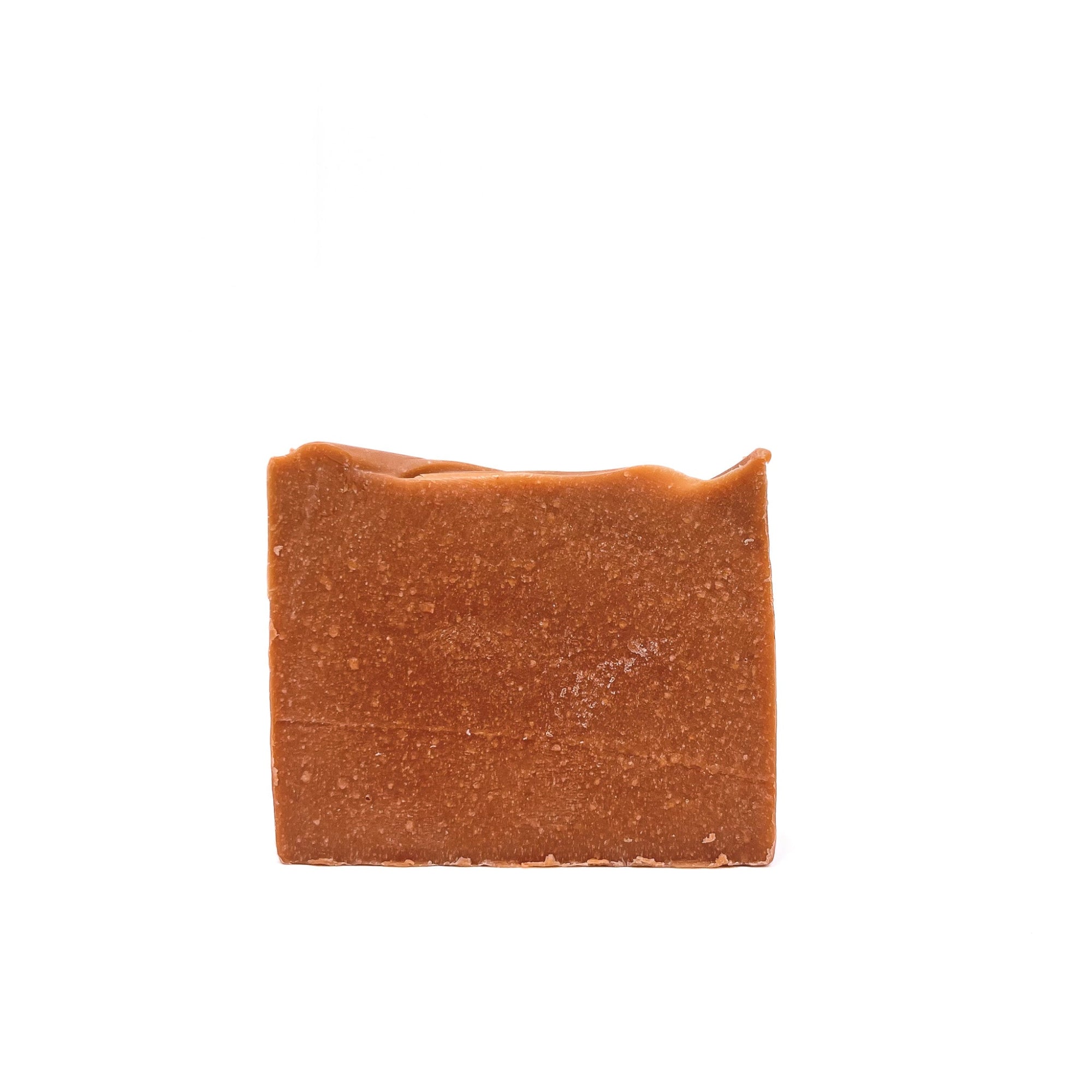 A front view of a bar of Rusted Acre Soap Company's Mahogany handmade soap. Color is brownish-red. 