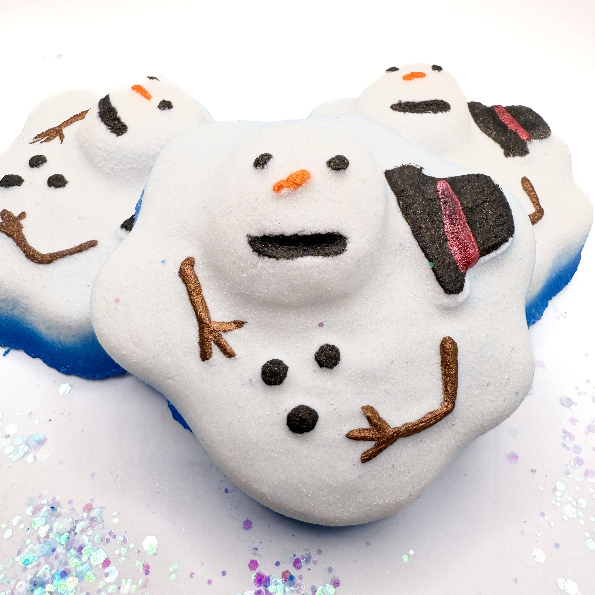 Melting Snowman themed bath bomb with decorative elements on a white background