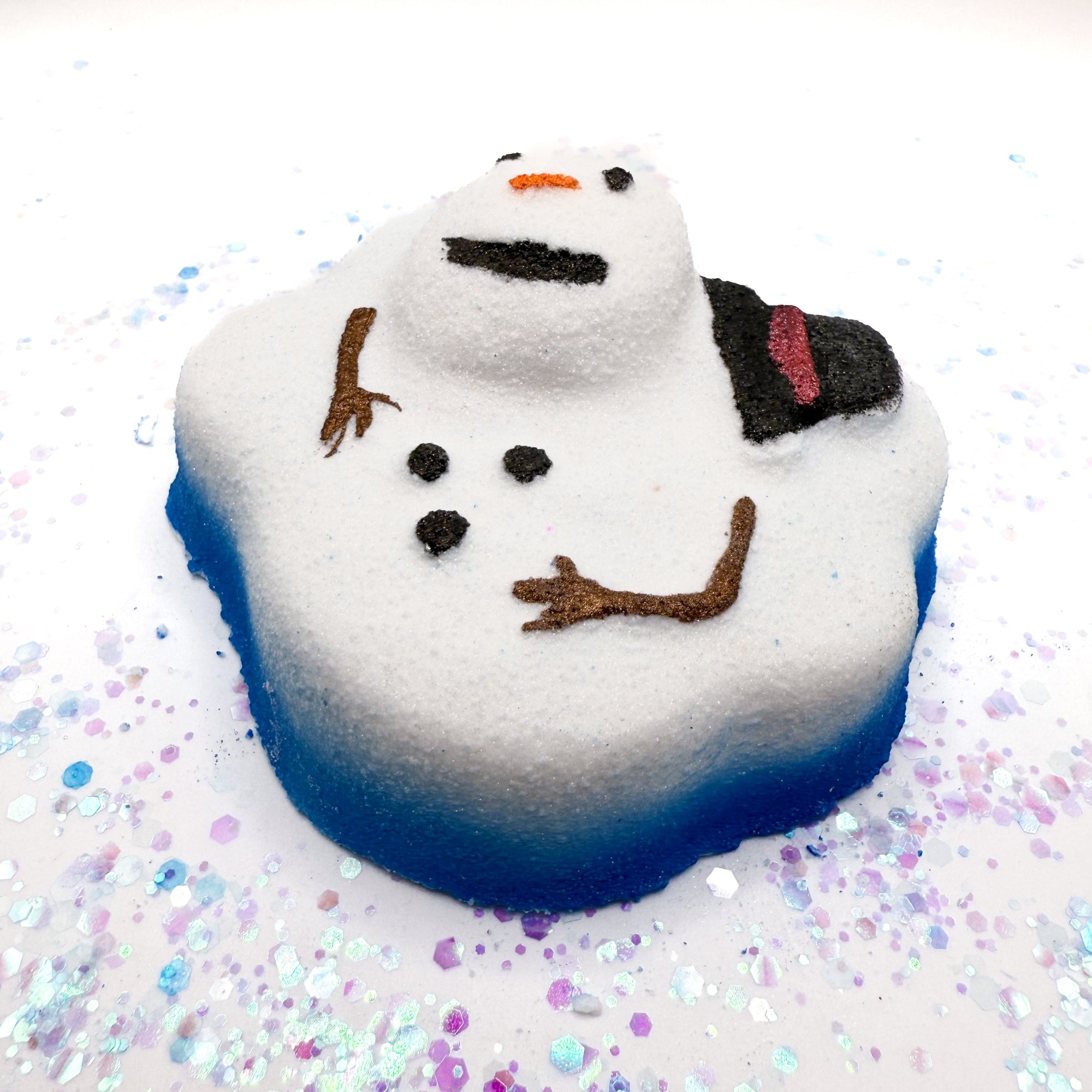 Melted snowman shaped bath bomb with a colorful glittery background.