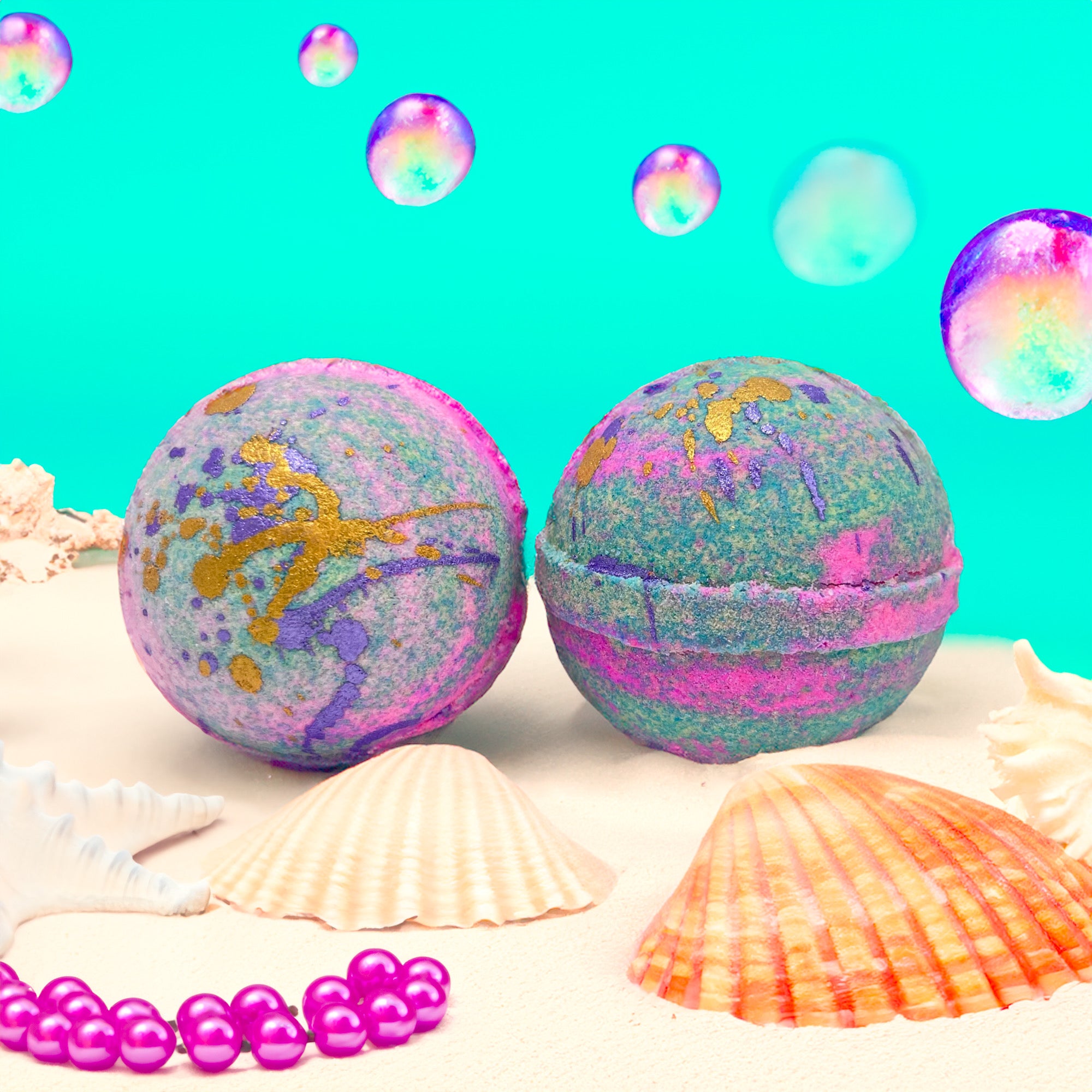 Two mermaid kiss bath bombs made by Rusted Acre Soap Company.