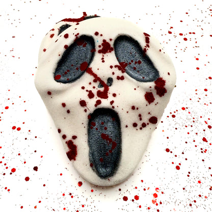 Front view of Midnight Caller bath bomb on white background with blood splatter effect. Handmade by Rusted Acre Soap Company. 