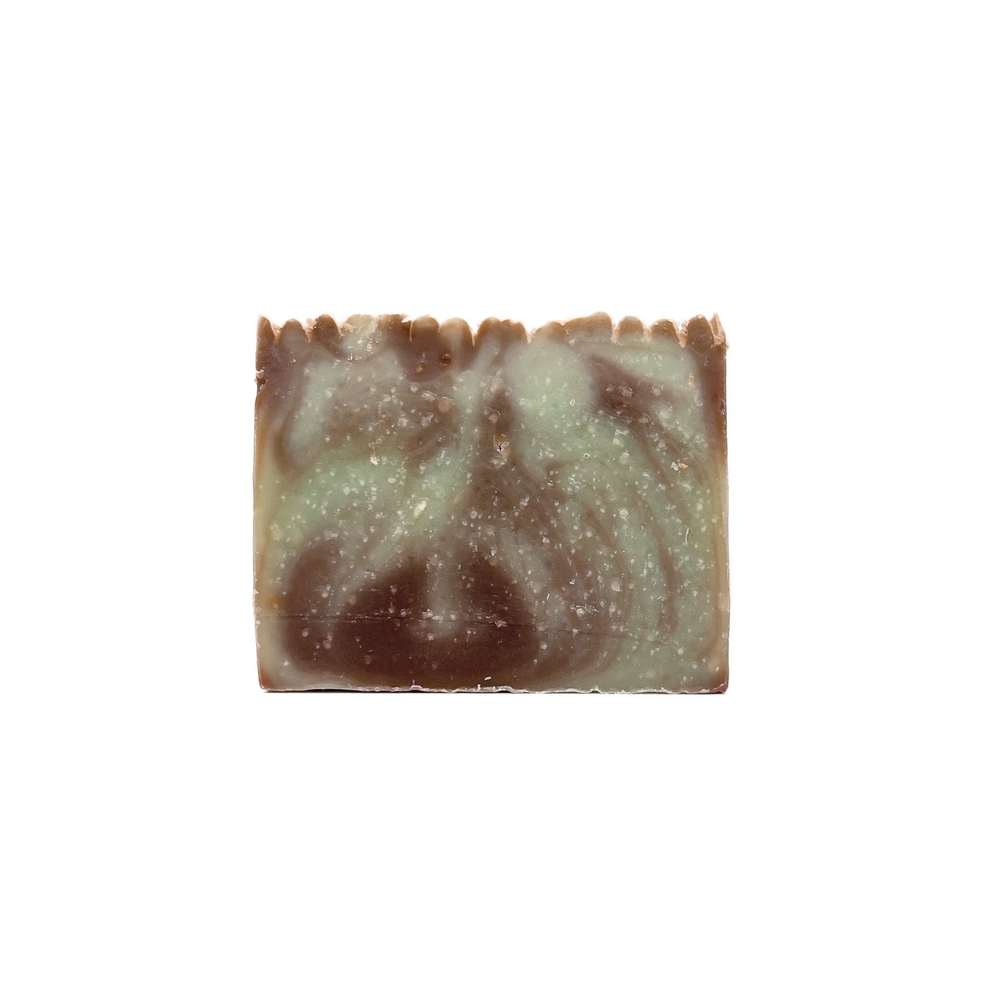A bar of handmade mint chocolate scented soap. The colors are swirled mint green and chocolate brown.