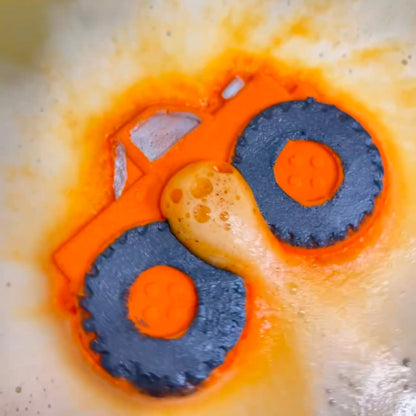 Rusted Acre Soap Companies orange monster truck bath bomb putting on a color show.