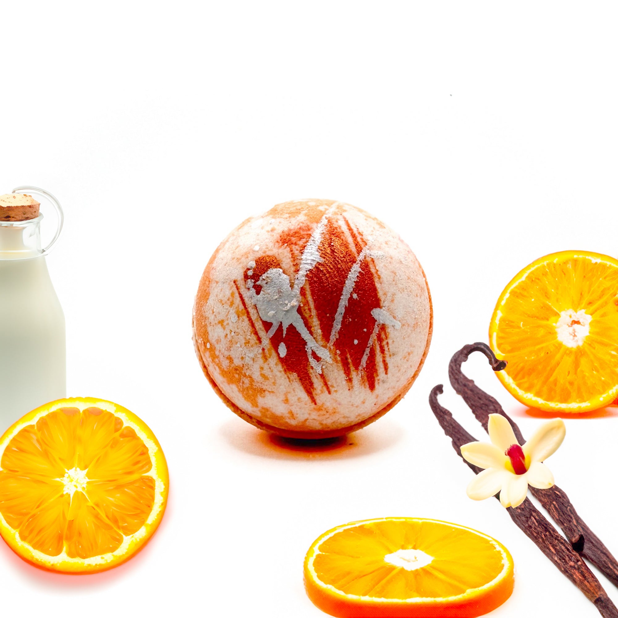 Round hand painted orange and white swirled bath bomb scented with a creamy orange vanilla scent. Handmade by Rusted Acre Soap Company bath bomb is set in a lifestyle setting with oranges, vanilla beans. 