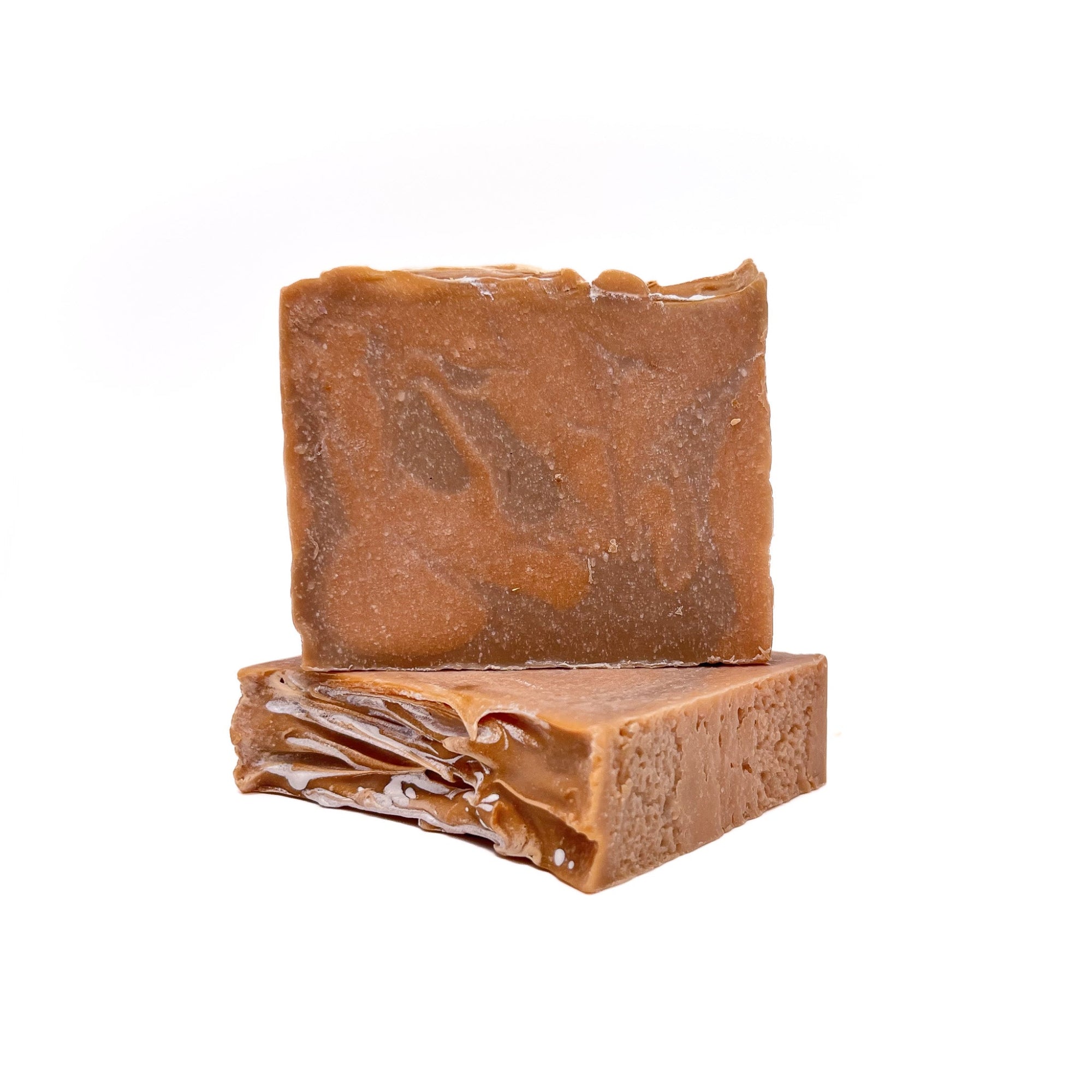 Two bars of handmade soap in orange dream scent. One standing and one lying flat to show texture.